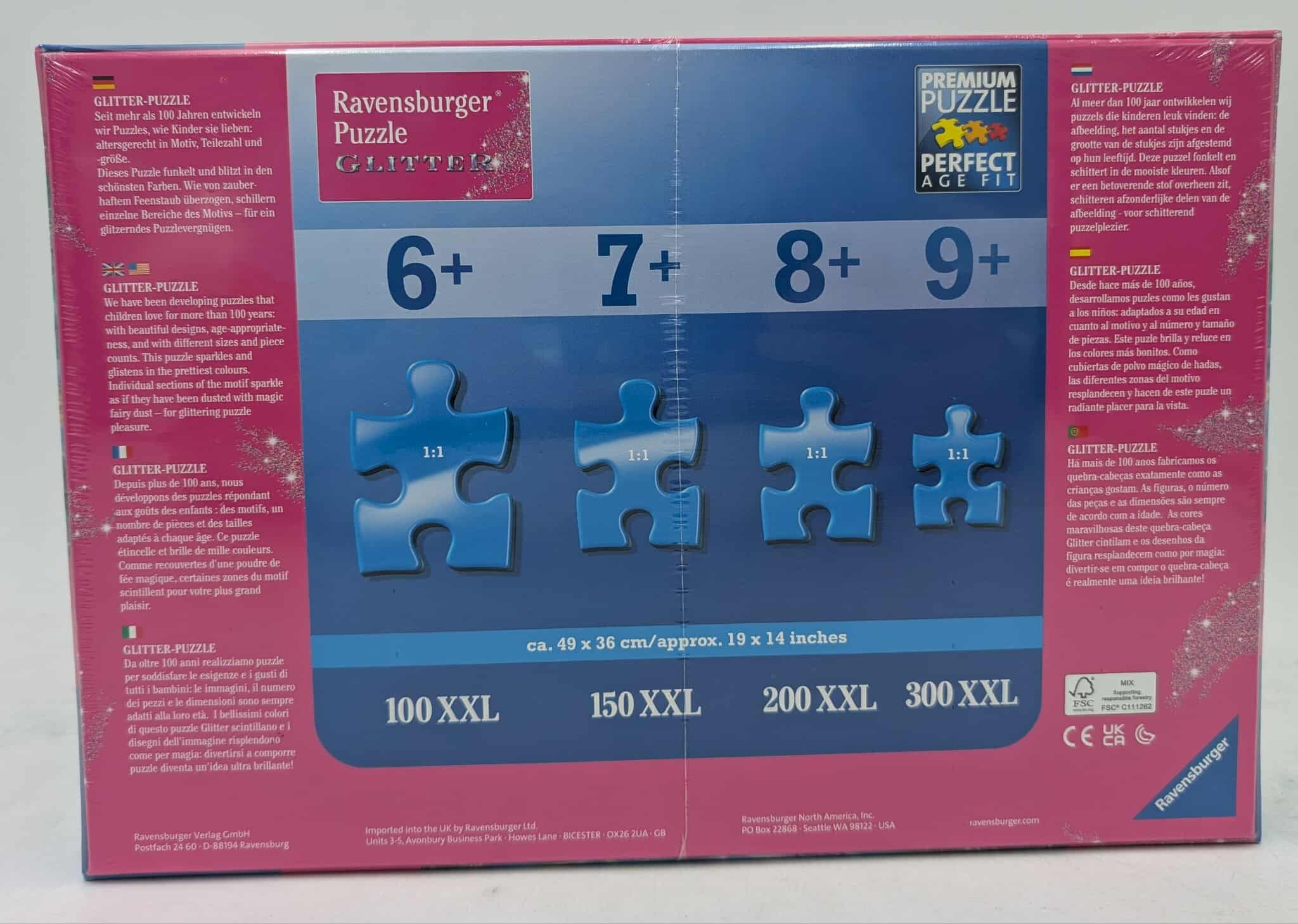 Puzzledose mit 'Ravensburger'-Logo, Altersangaben, Puzzleteilen und Glitzereffekt in leuchtenden Blau- und Rosatönen.