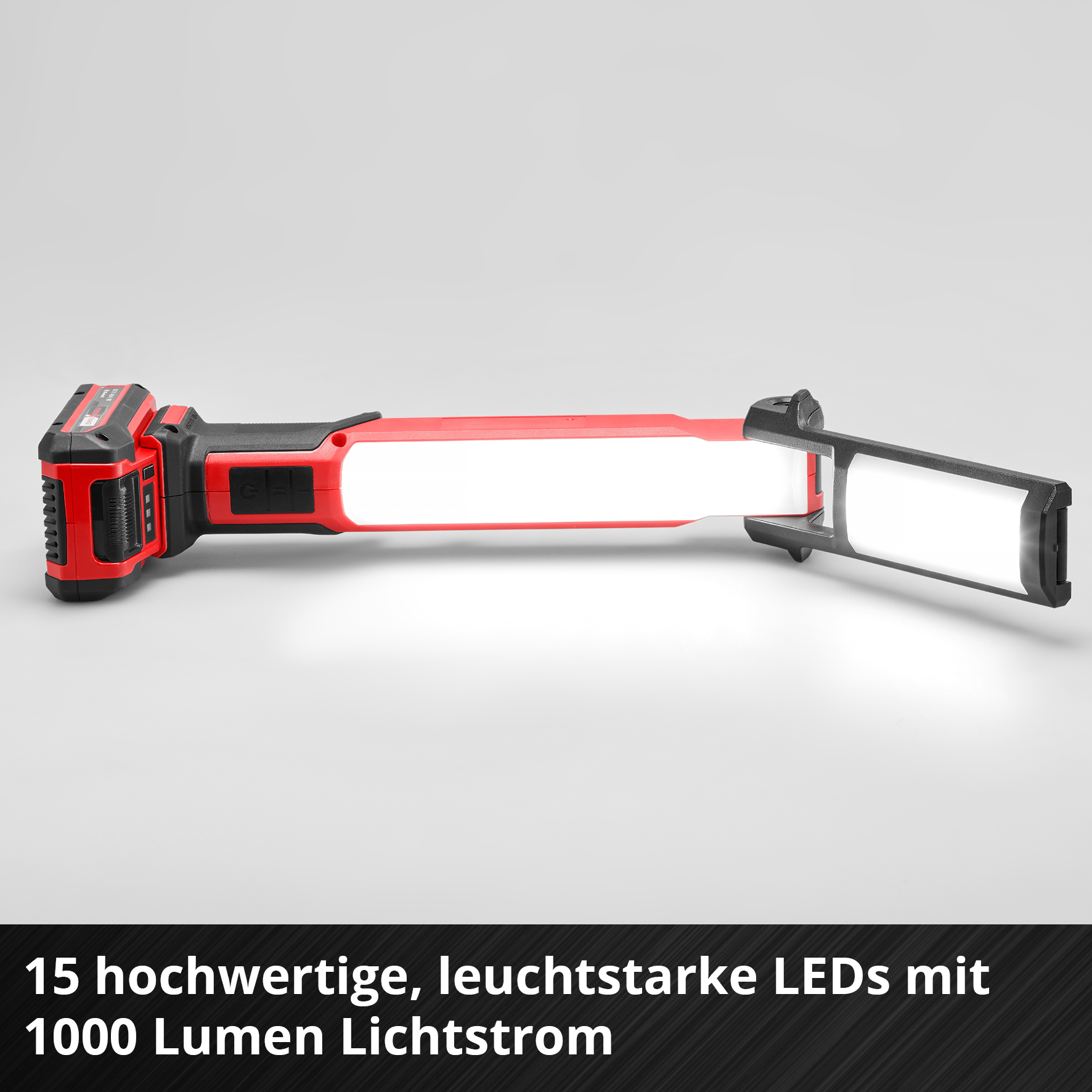 Rote und schwarze LED-Arbeitsleuchte mit Akku. Sie hat zwei Lichtpaneele. Der Text unten lautet: 15 LEDs mit 1000 Lumen.