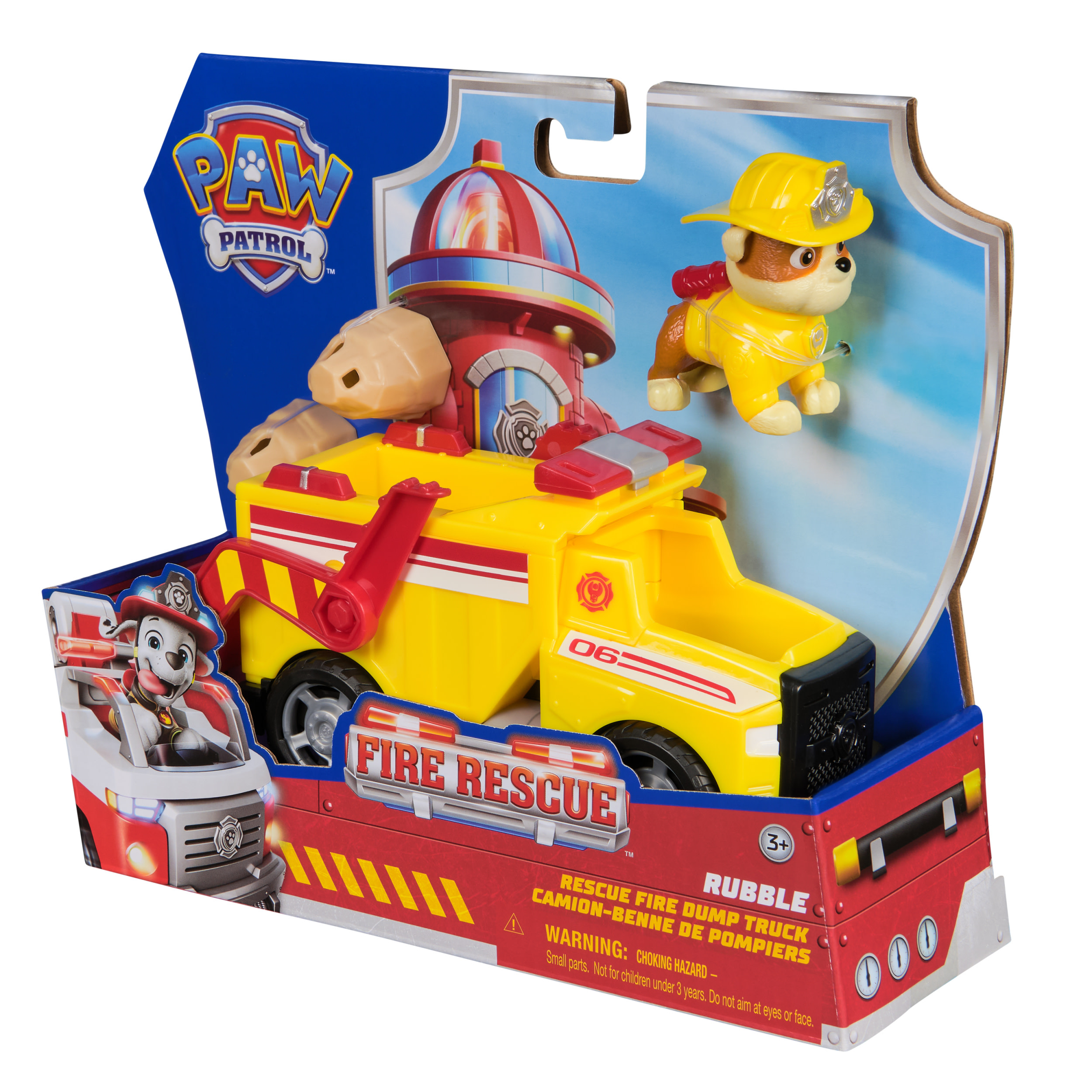 Un coffret de jouets Pat' Patrouille. Il comprend un camion de pompiers jaune et une figurine de Rubble en uniforme jaune, emballés.
