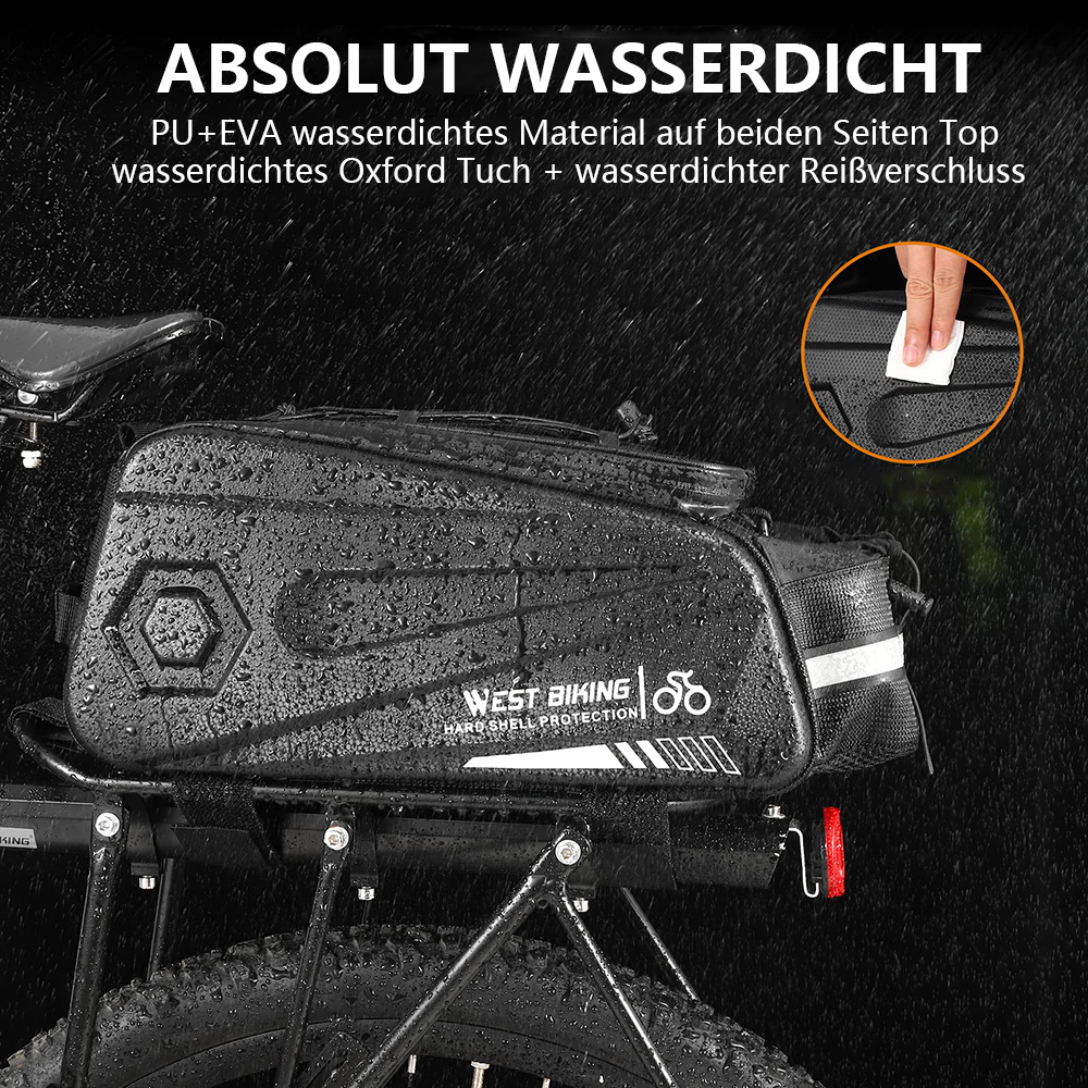 Eine schwarze Fahrradtasche ist an einem Fahrrad befestigt. Sie trägt die Aufschrift 'WEST BIKING' und 'HARD SHELL PROTECTION'. Eine Hand wischt die Tasche ab.