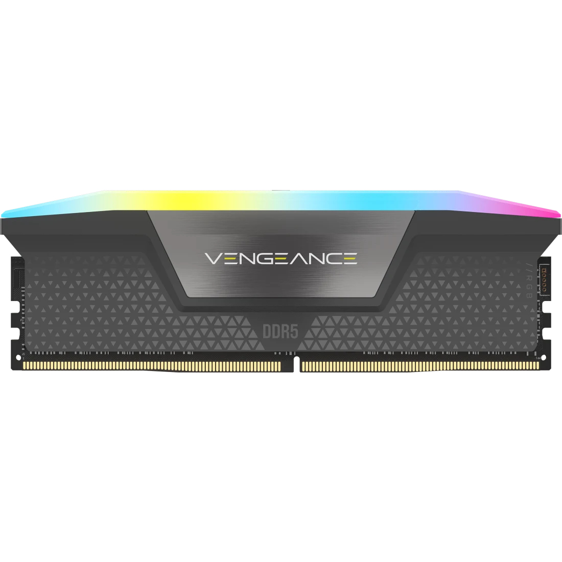 Módulo RAM con la marca Vengeance DDR5. Tiene un diseño de metal gris con una superficie estampada y una barra de luz multicolor en la parte superior.