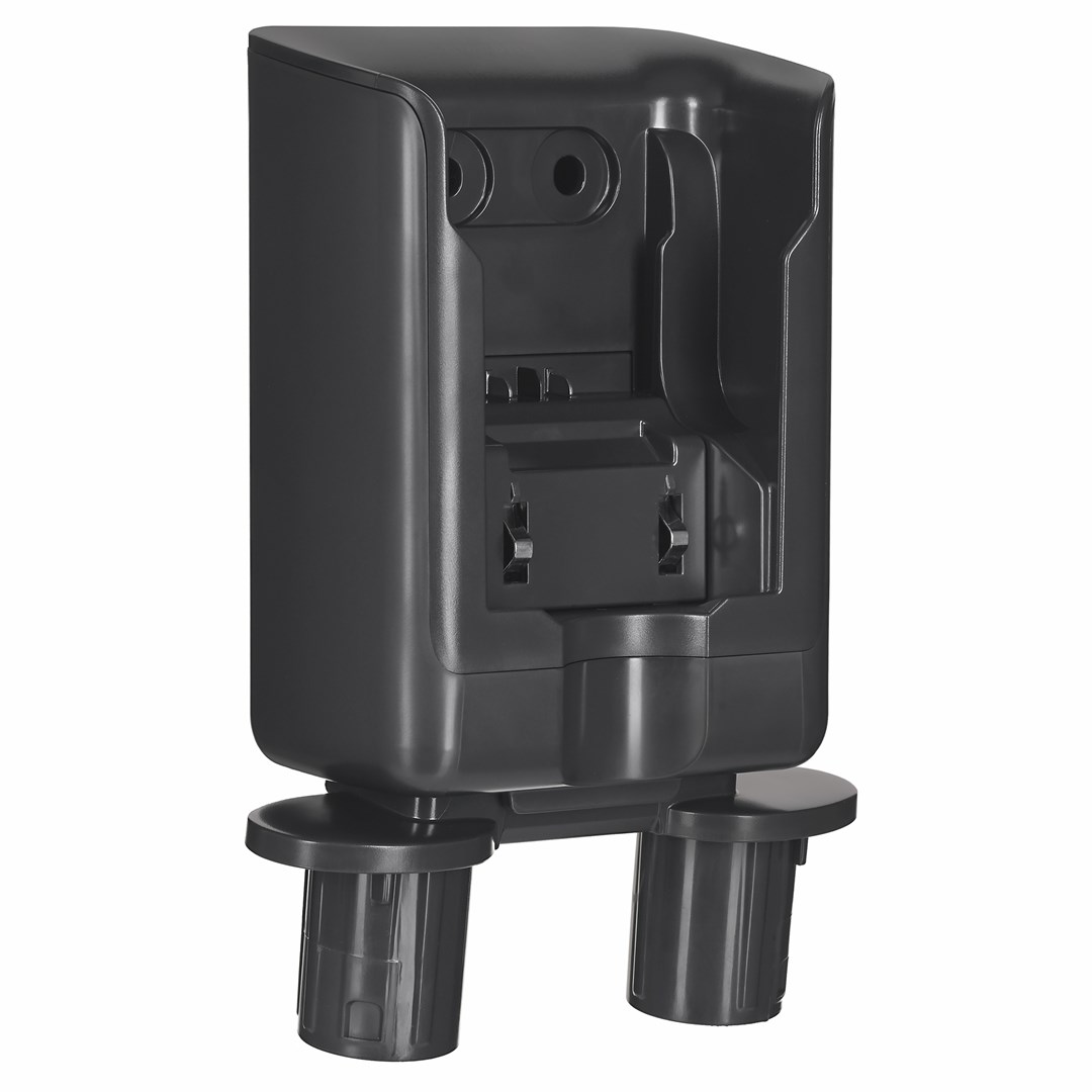 Ciemnoszare plastikowe urządzenie. Ma prostokątny korpus z kilkoma przegródkami i dwoma cylindrycznymi podporami na dole.