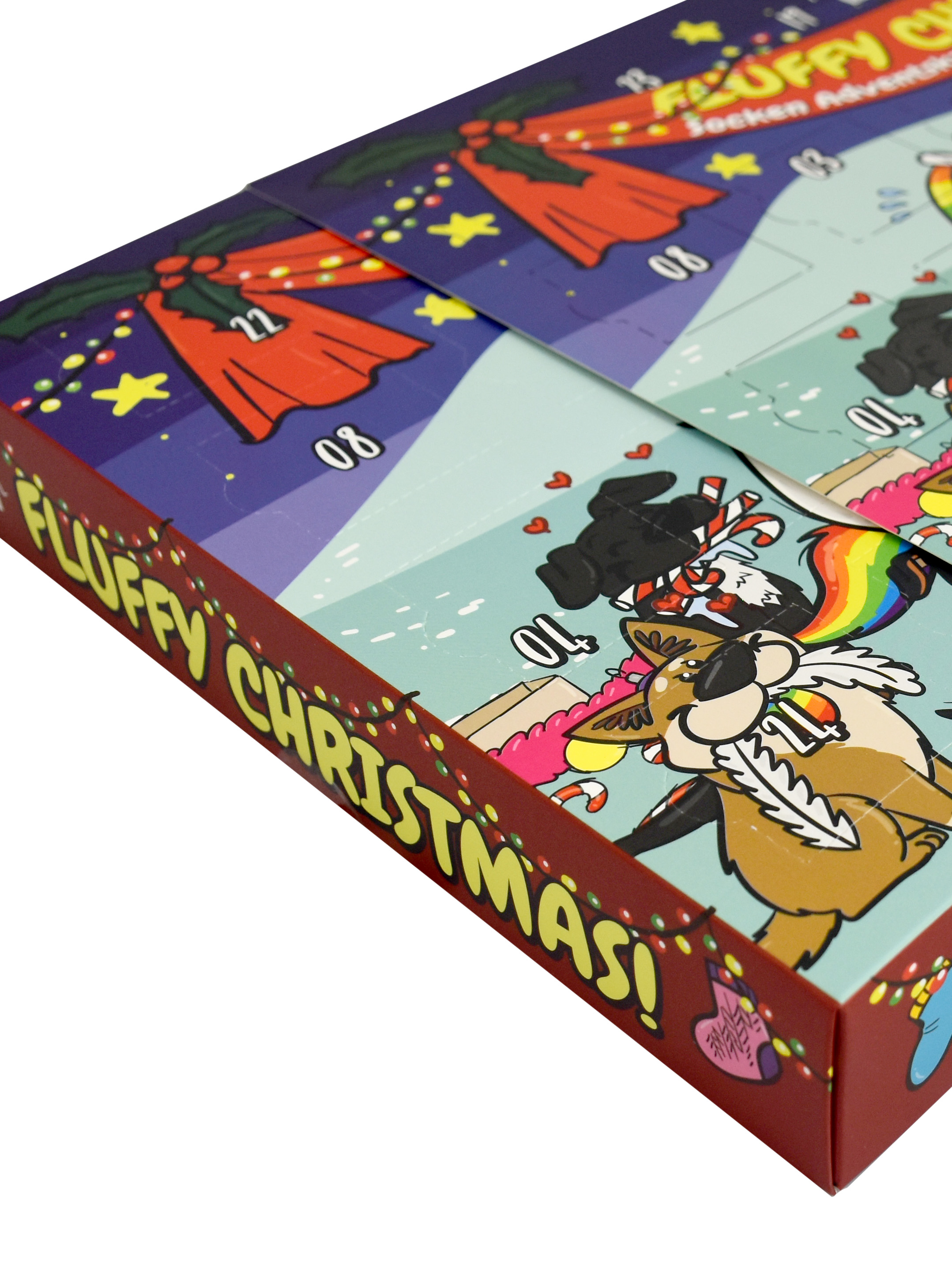 Adventskalenderbox. Rote, grüne und gelbe Schrift. Zeichentrickfiguren sind vorhanden. Die Box ist für Fluffy Christmas.