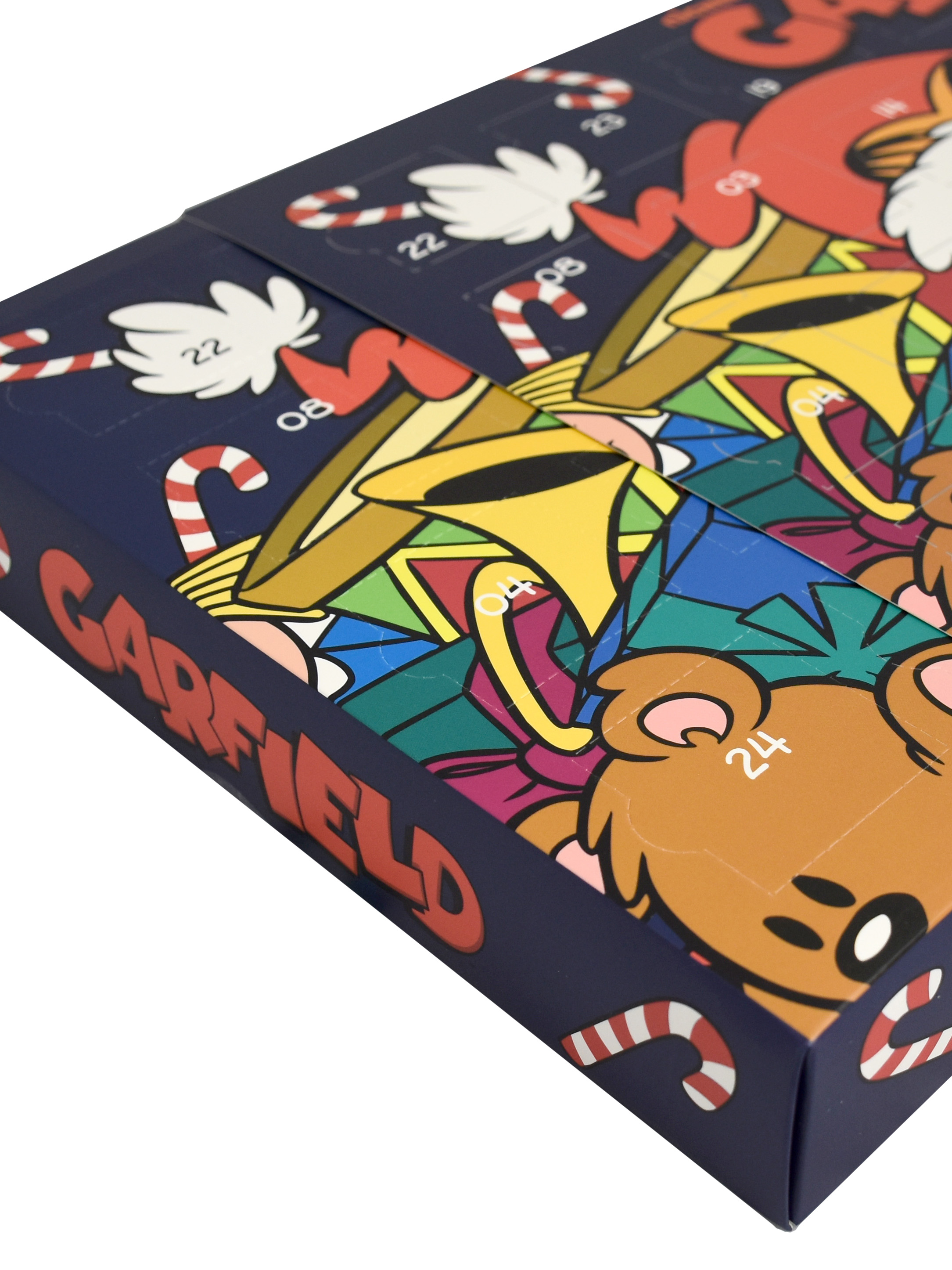 Ein Adventskalenderkarton mit einem Garfield-Cartoon-Design. Zuckerstangen und Zeichentrickfiguren sind sichtbar.