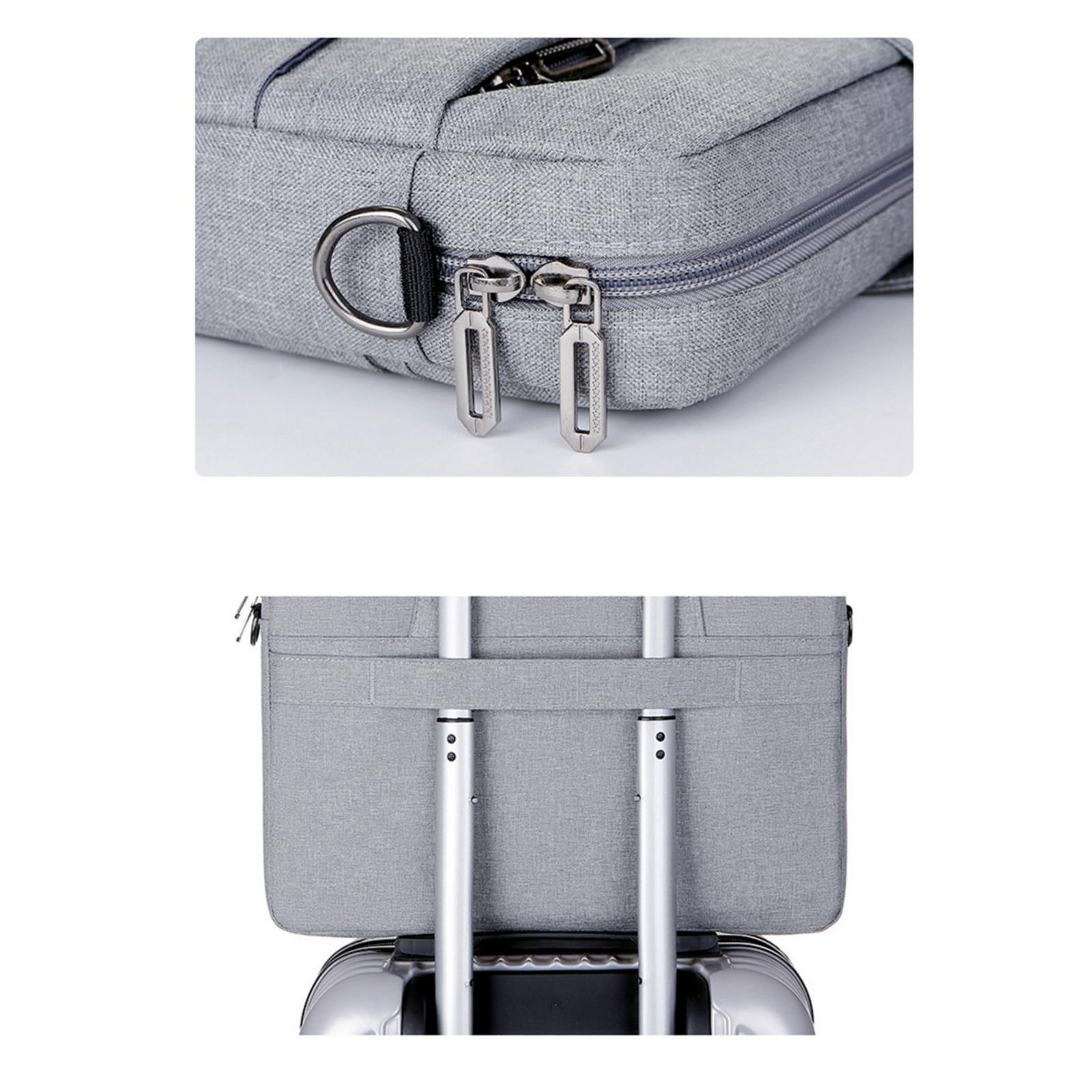 Graue Laptoptasche, Nahaufnahme von Reißverschlüssen und D-Ring. Die Tasche ist auf einem Koffer platziert.