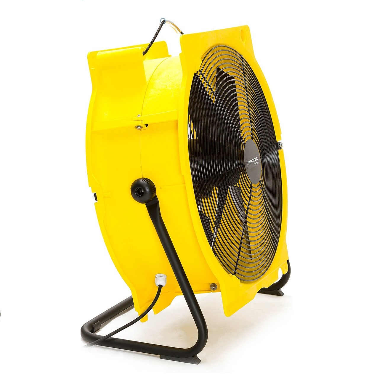 A yellow industrial fan with black blades and a black stand on a white surface. The fan is angled to the right.