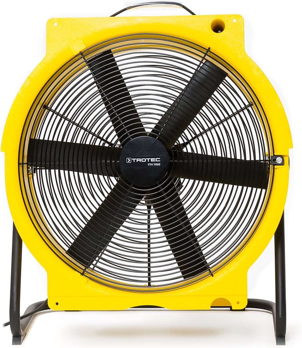 A yellow and black Trotec TTV 7000 fan. It has a circular design with black blades and a black center. It sits on black legs.
