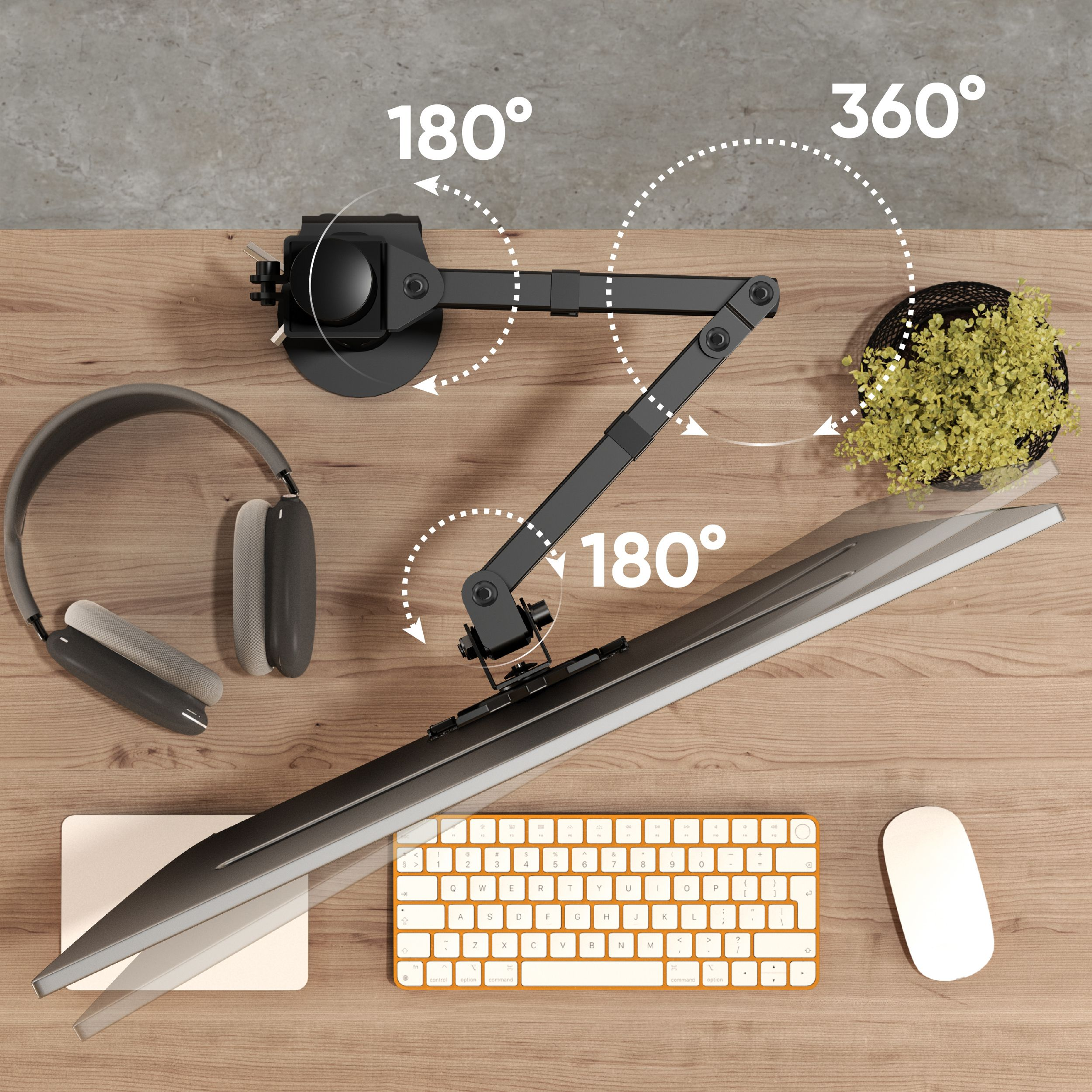Configuration de bureau avec bras de moniteur, clavier, souris, casque et plante. Degrés de rotation indiqués.