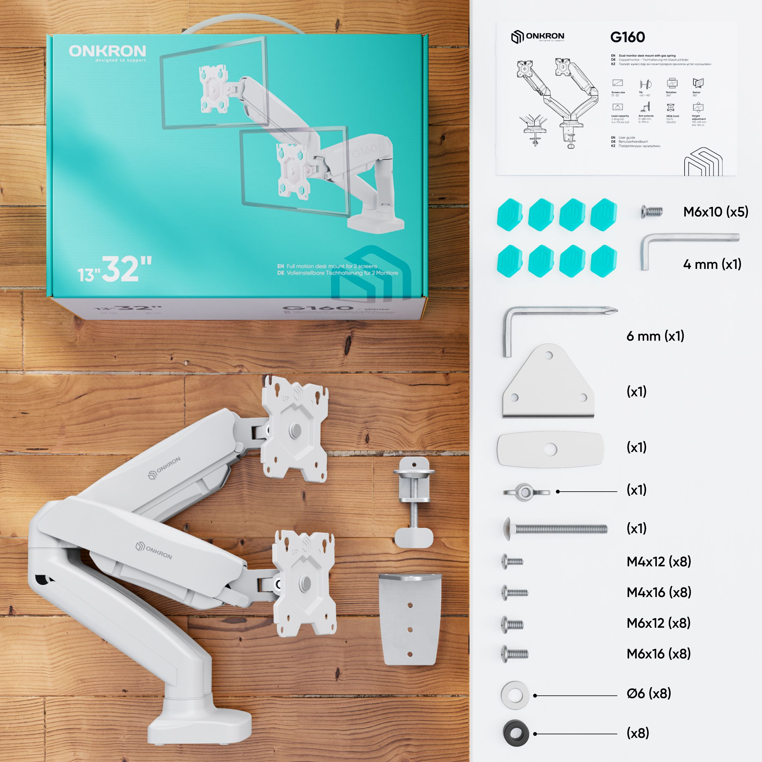 Zmontowany biały stojak na monitor, pudełko i komponenty na drewnianej powierzchni. Widoczne etykiety tekstowe i lista części.