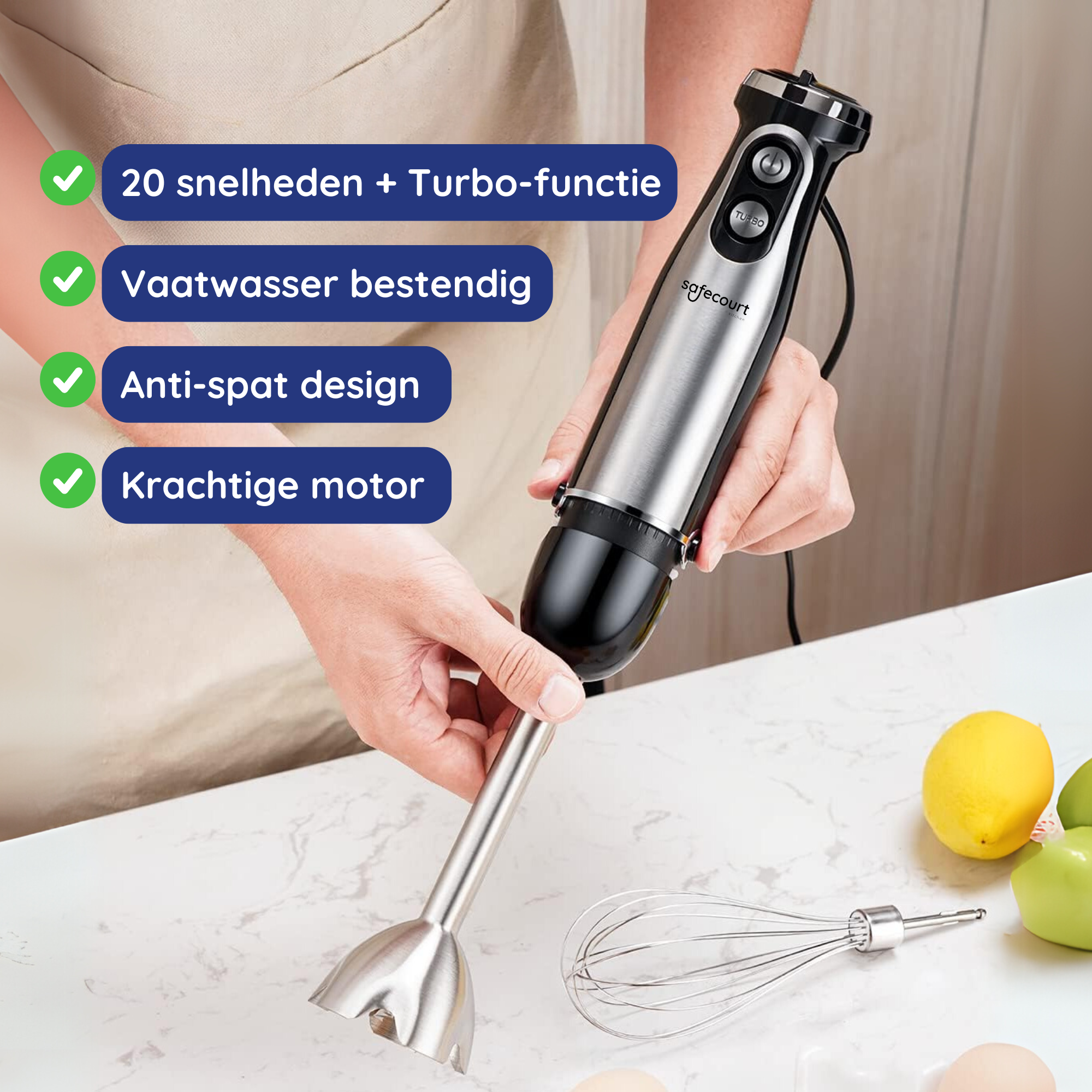 A person holds a silver and black hand blender. There are text labels with green checkmarks and a whisk is on the table.