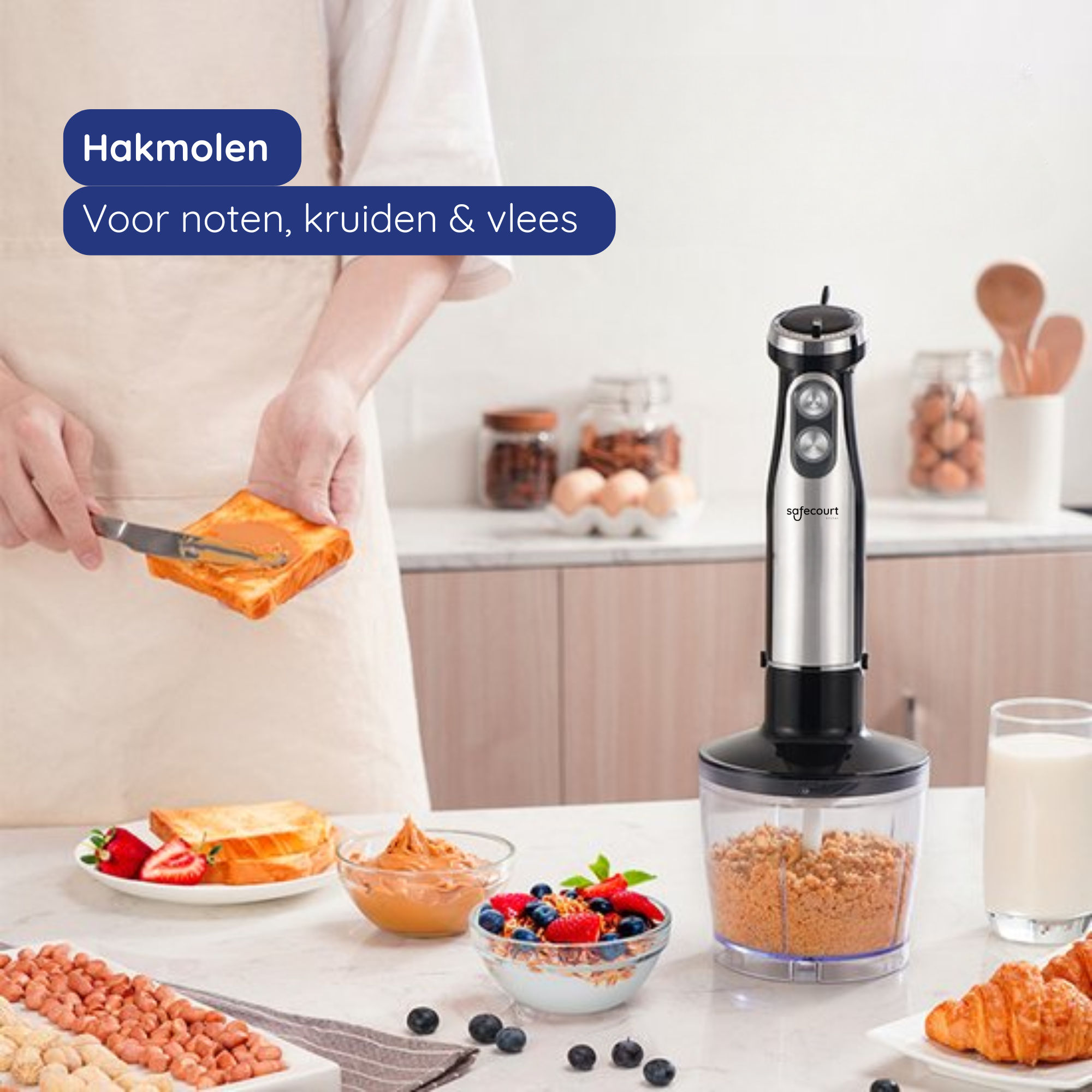 A person spreads peanut butter on toast. A blender and food items like berries, peanuts, and croissants are on the table.