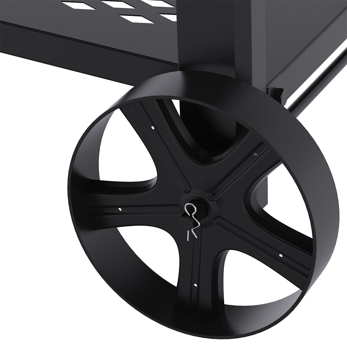 Close-up of a black wheel and part of a grill cart. The wheel has a pin and a unique spoke design. The cart is also black.