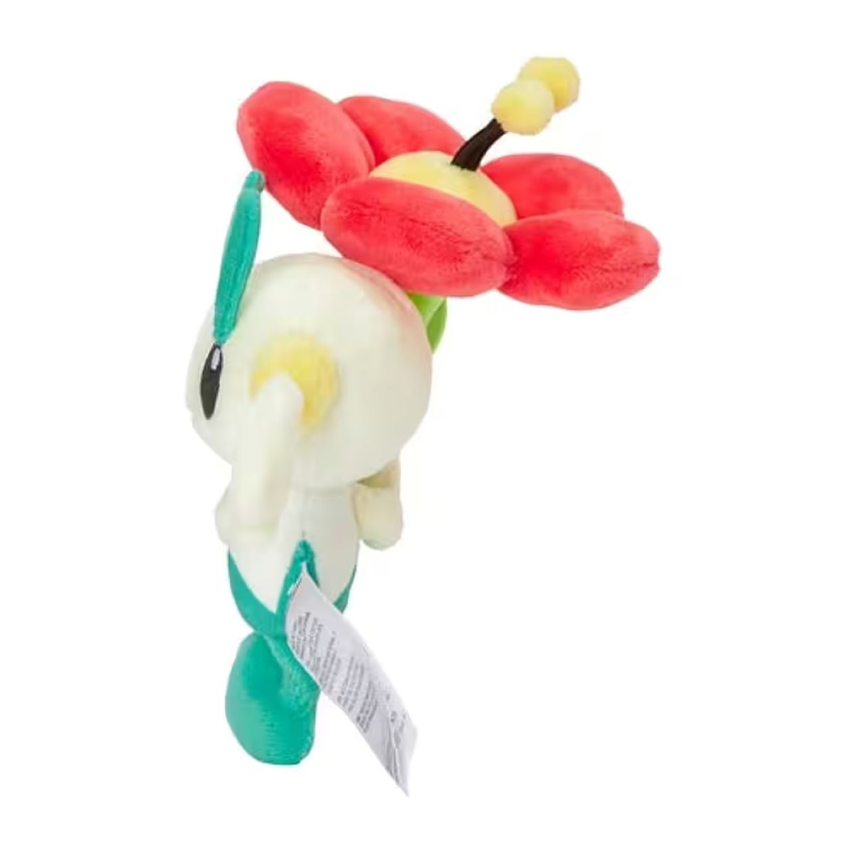 Ein Stofftier in Form einer Blume mit roten Blütenblättern, gelber Mitte und weißem Körper. Am Spielzeug ist ein Etikett befestigt.