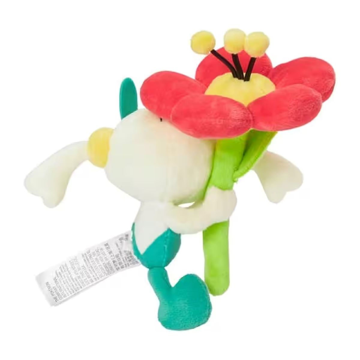 Ein Plüschtier einer Blume mit Gesicht. Es hat rote Blütenblätter, einen grünen Stiel und einen weißen Körper. Ein Etikett ist befestigt.