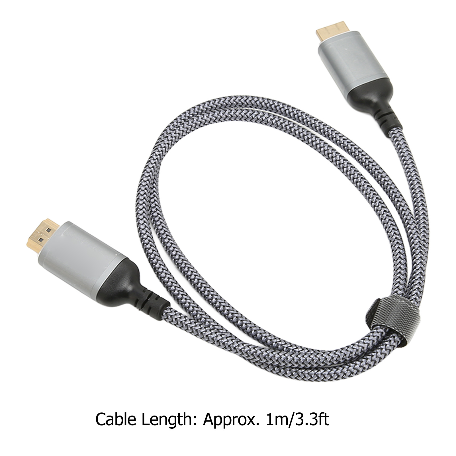 Ein geflochtenes graues Kabel mit silbernen Steckern. Das Kabel ist geschlungen und mit einem Klettverschluss gesichert.