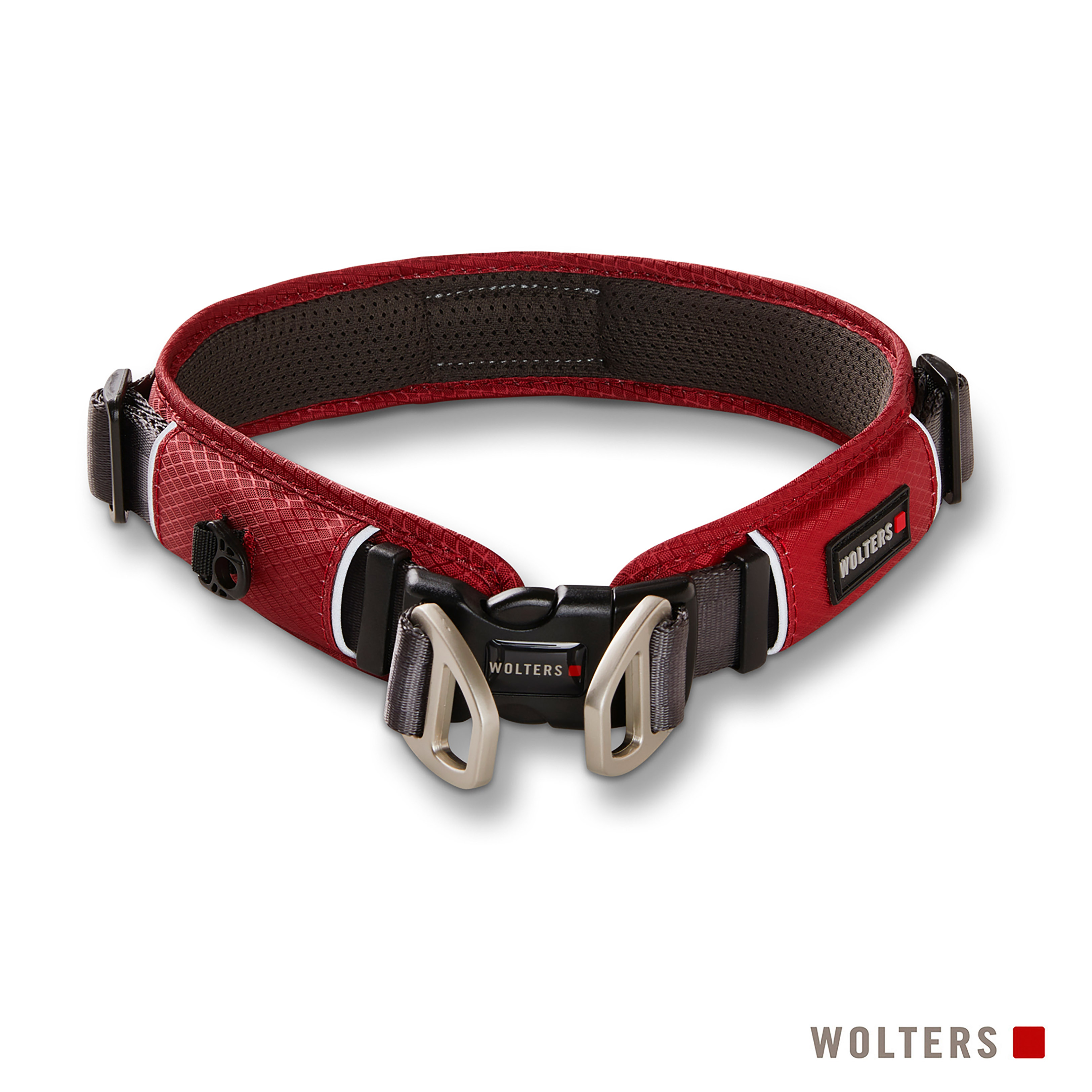 Rotes Hundehalsband mit schwarzer Schnalle und Metallverschlüssen. Die Marke 'WOLTERS' ist sichtbar.