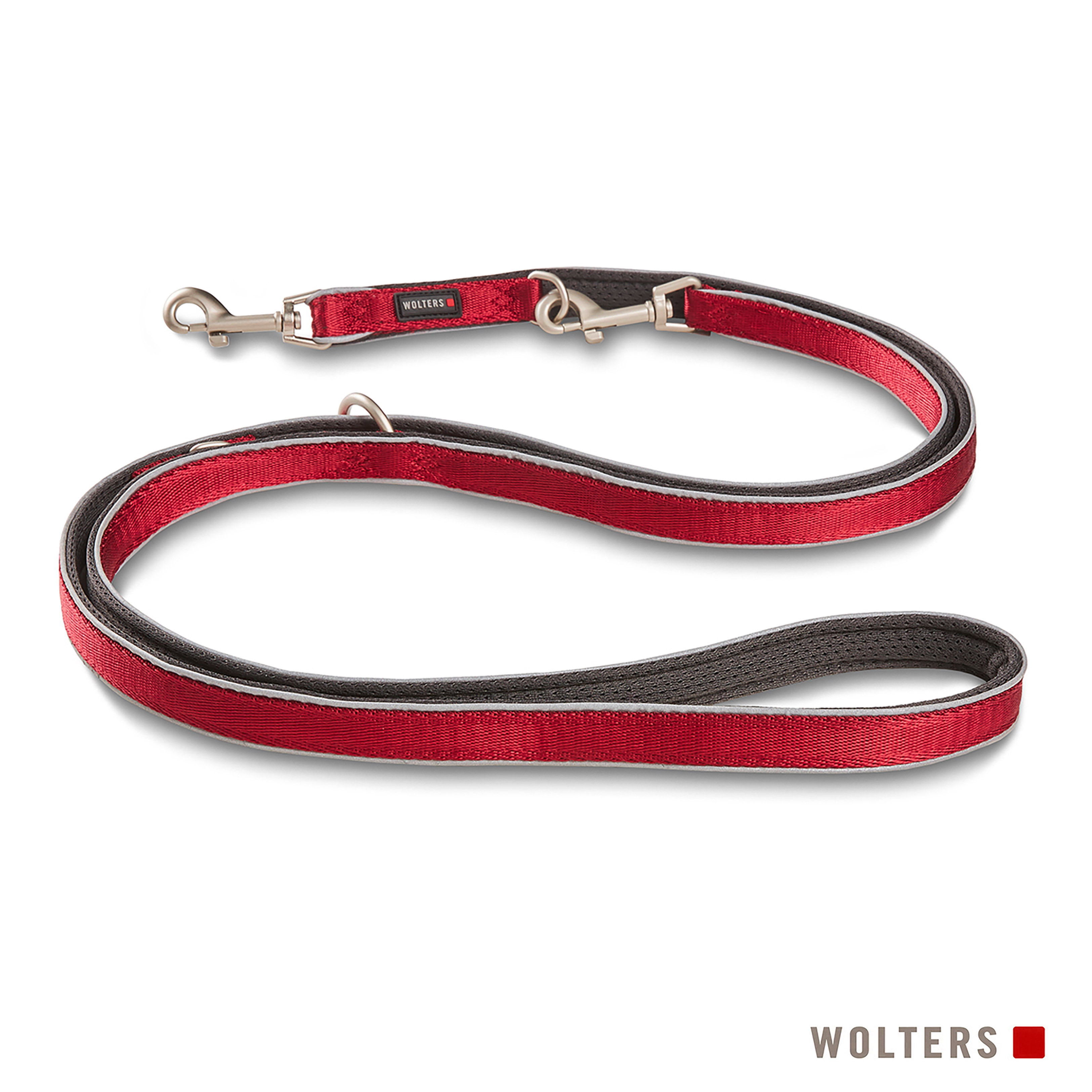 Rote Hundeleine mit silbernen Verschlüssen, schwarzem Innenraum und weißem Rand. Markenname 'WOLTERS'.