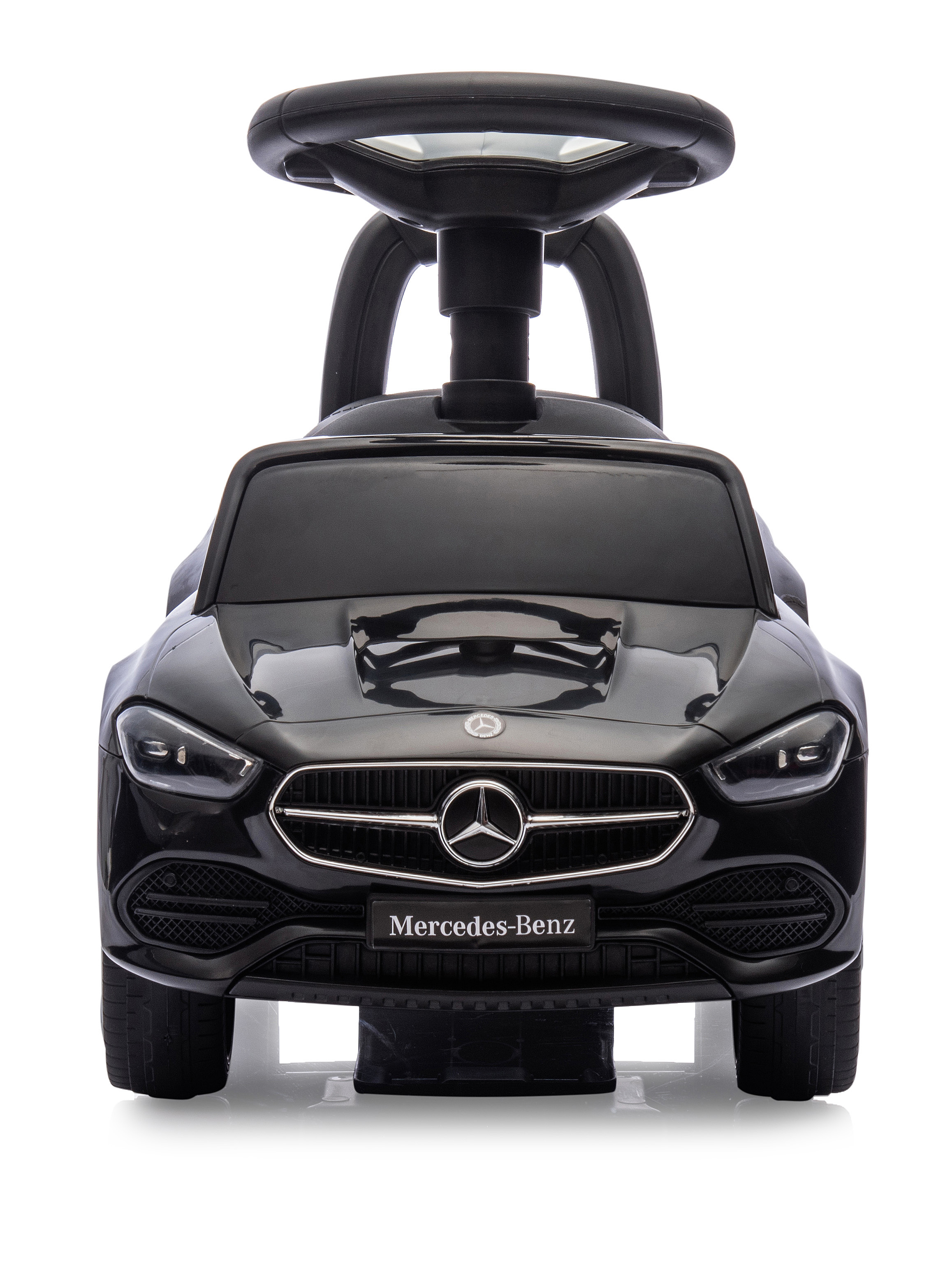 Schwarzes Mercedes-Benz Spielzeugauto. Es hat ein Lenkrad, Scheinwerfer und das Mercedes-Logo.