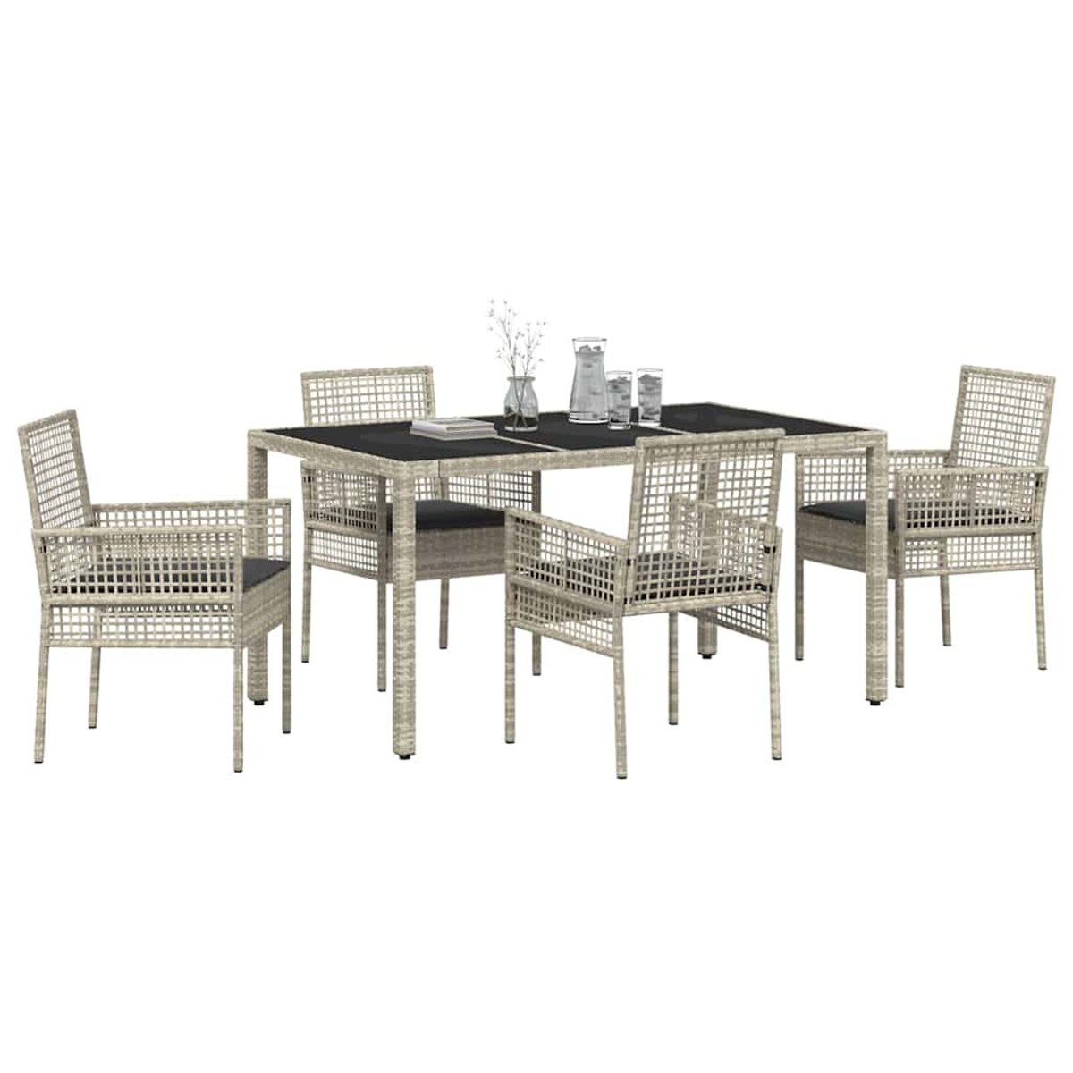 Ein Terrassen-Ess-Set mit einem rechteckigen Tisch und vier Stühlen. Der Tisch hat eine schwarze Oberseite. Eine Vase, Gläser stehen auf dem Tisch.