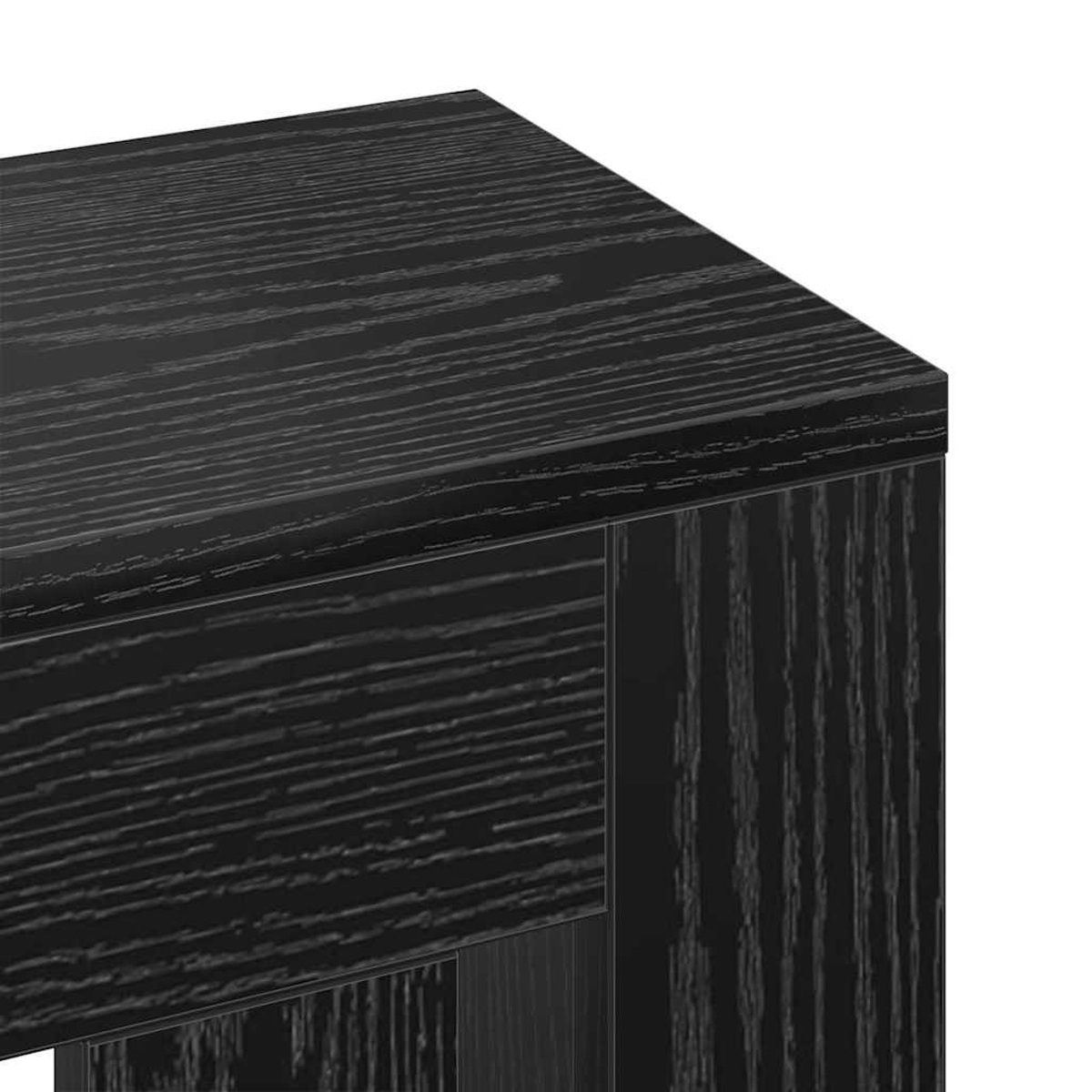 Nahaufnahme einer dunklen Holztischecke. Die Holzmaserung ist sichtbar. Der Tisch hat eine feste, rechteckige Form mit vertikalen Stützen.