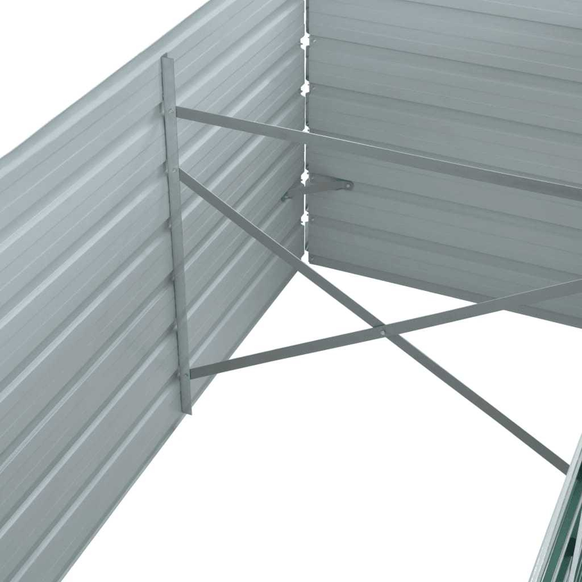Metallkonstruktion mit grauen Wellplatten und Stützbalken. Die Struktur ist vor weißem Hintergrund teilweise sichtbar.