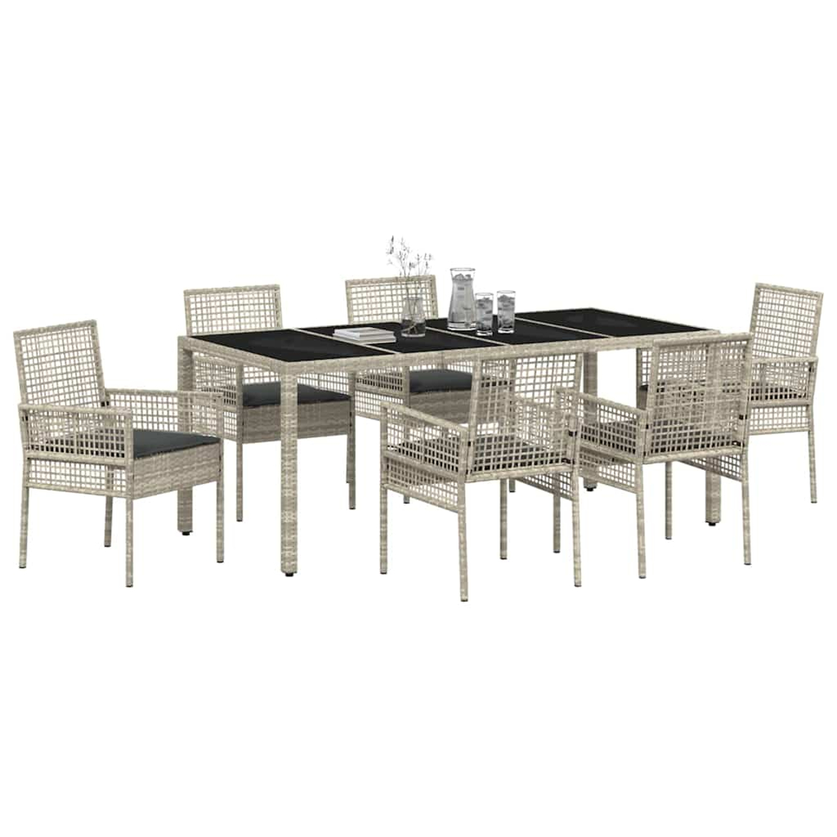 Ein Terrassenset mit einem rechteckigen Tisch und sechs Stühlen. Der Tisch hat eine schwarze Oberfläche. Es gibt einen Krug, Gläser und Blumen.