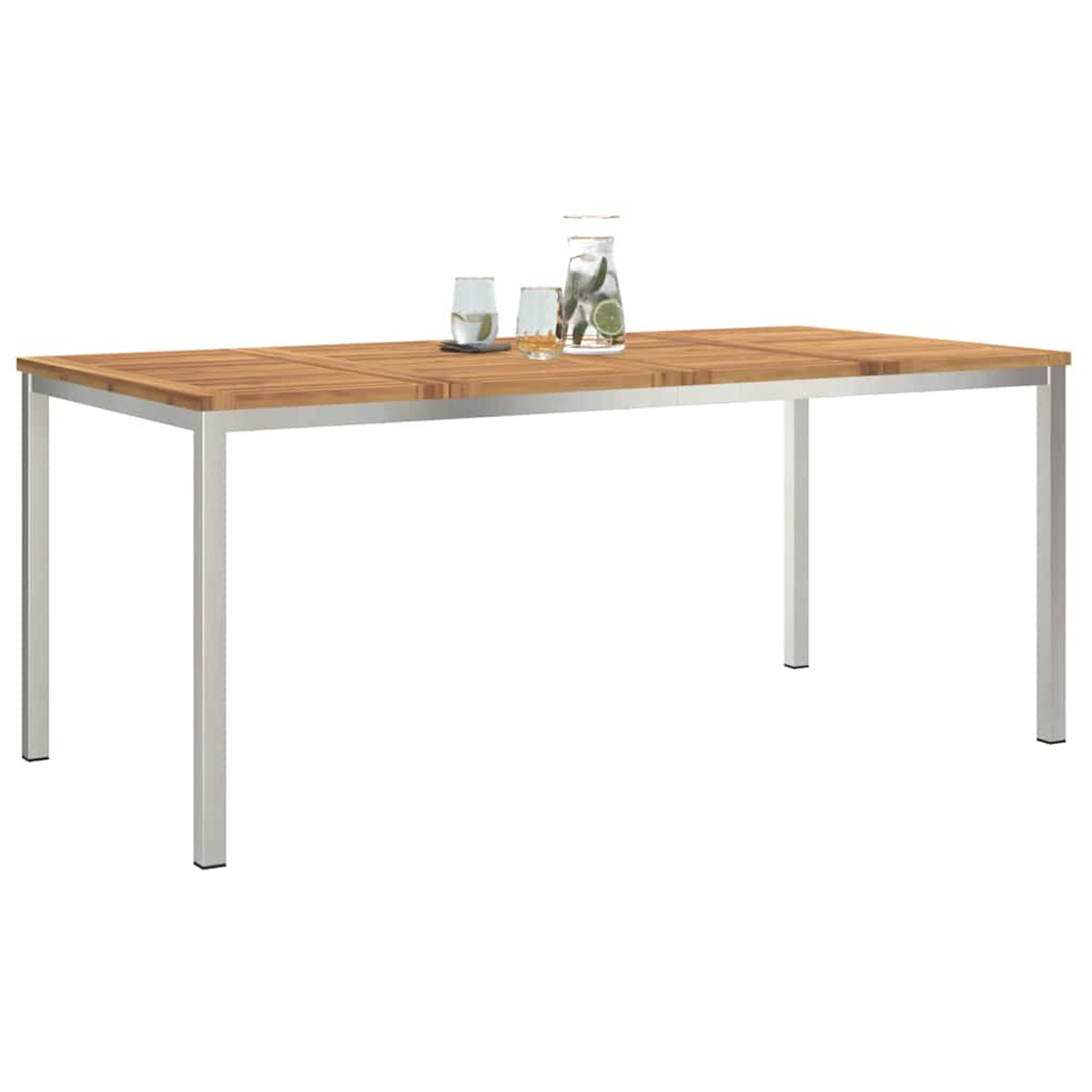 Holztisch mit silbernen Beinen. Zwei Gläser und eine Wasserkaraffe mit Limette und Minze oben drauf.