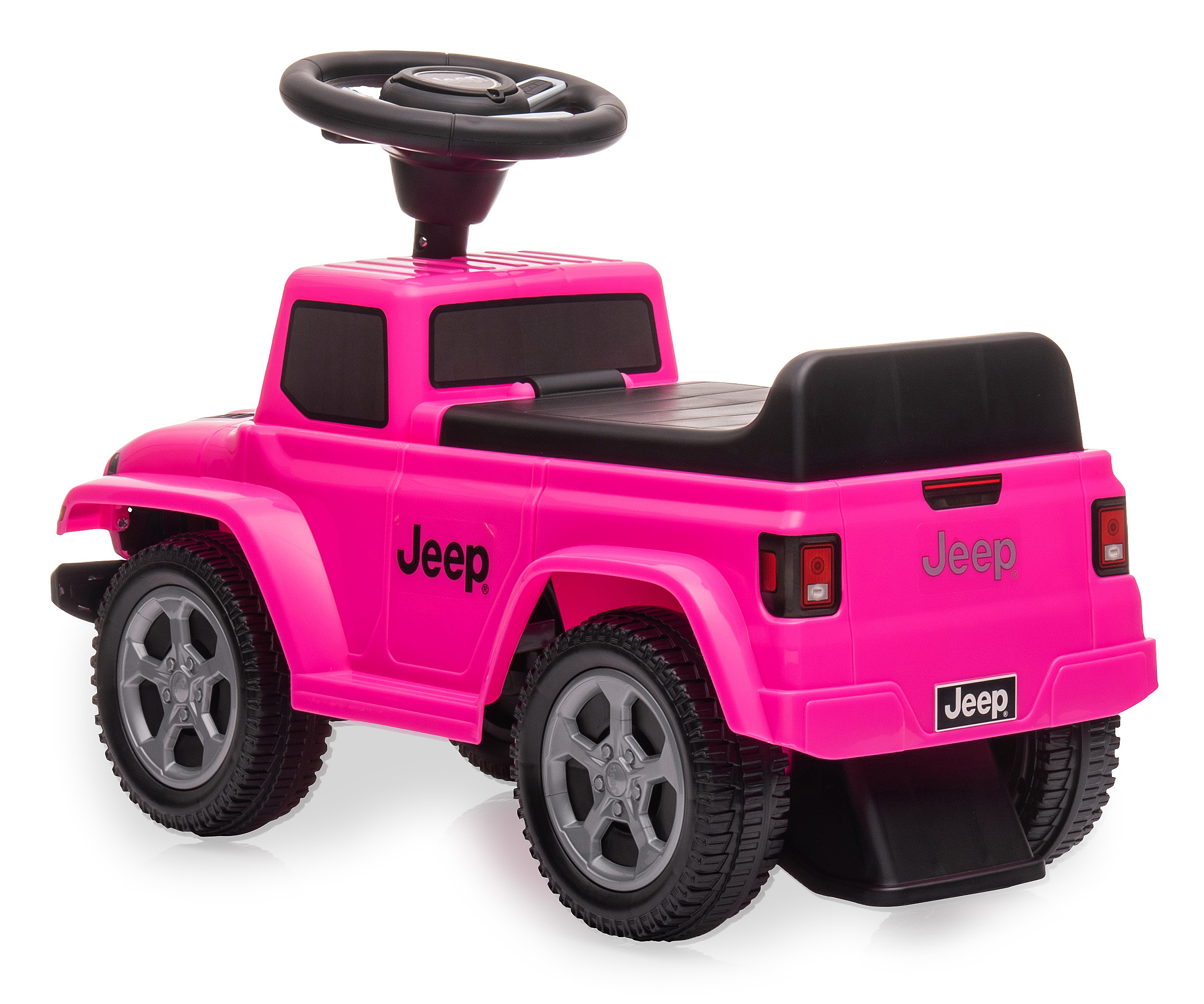 Ein rosa Jeep-Spielzeugauto. Es hat schwarze Räder und ein Lenkrad. Der Hintergrund ist weiß.