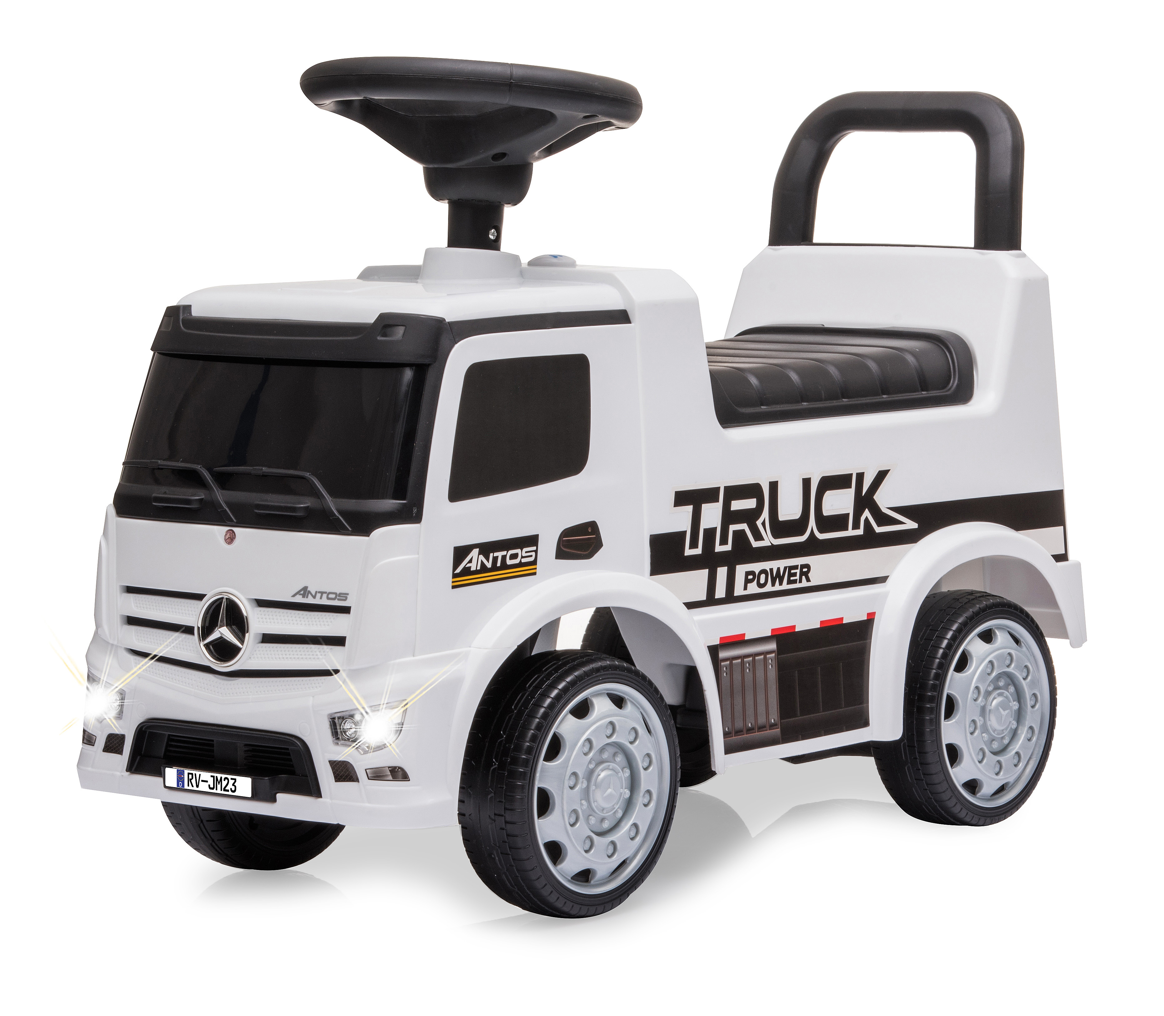 Biała zabawka ciężarówka z czarnymi detalami, kierownicą i napisem 'TRUCK' z boku. Reflektory są włączone.