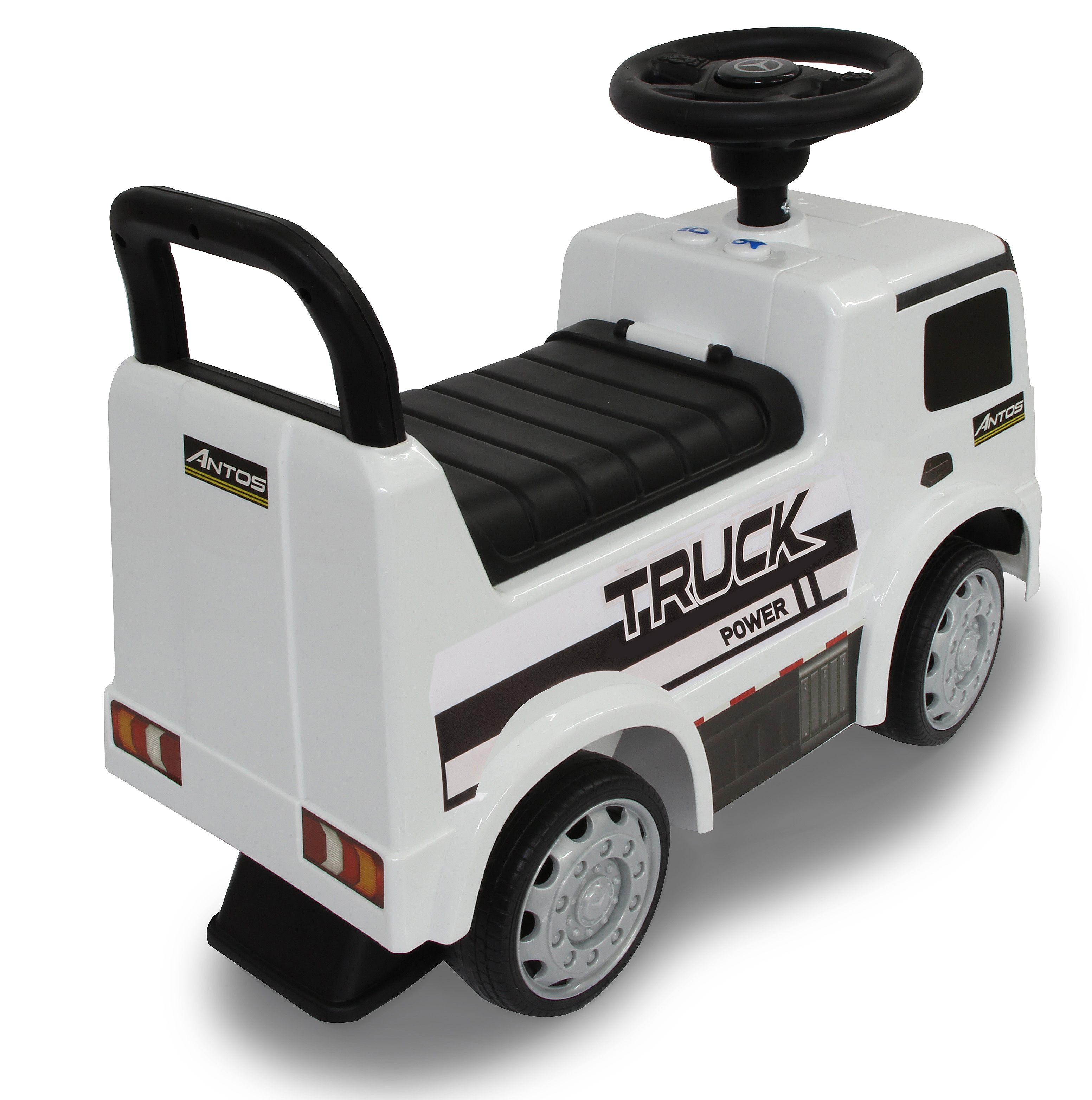 Biała zabawka ciężarówka z czarnymi akcentami i kołami. Widoczne słowo 'TRUCK'. Ma kierownicę i siedzenie.
