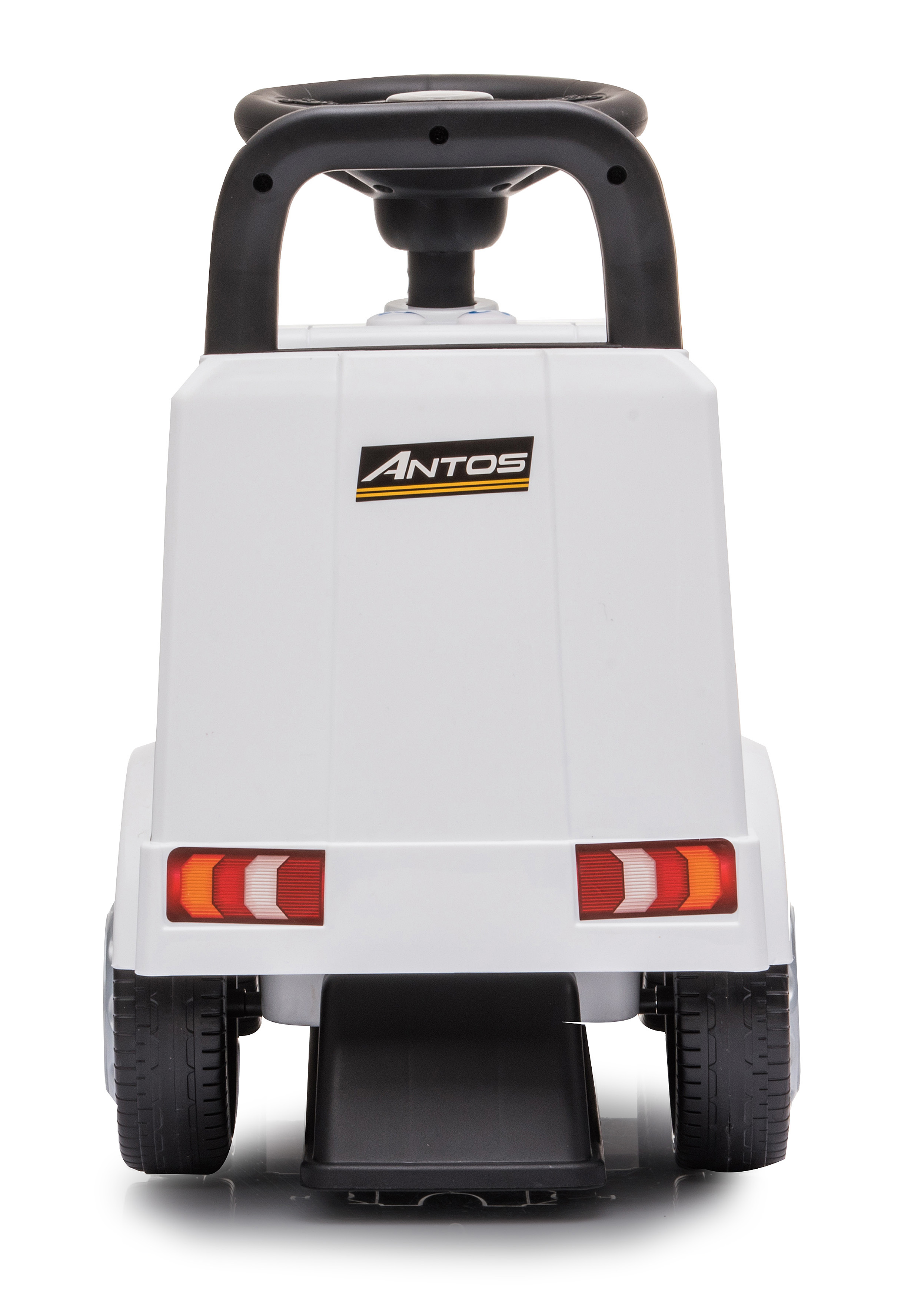 Biała zabawka ciężarówka z czarną kierownicą, oponami i logo Antos. Tylne światła są czerwone, pomarańczowe i białe.
