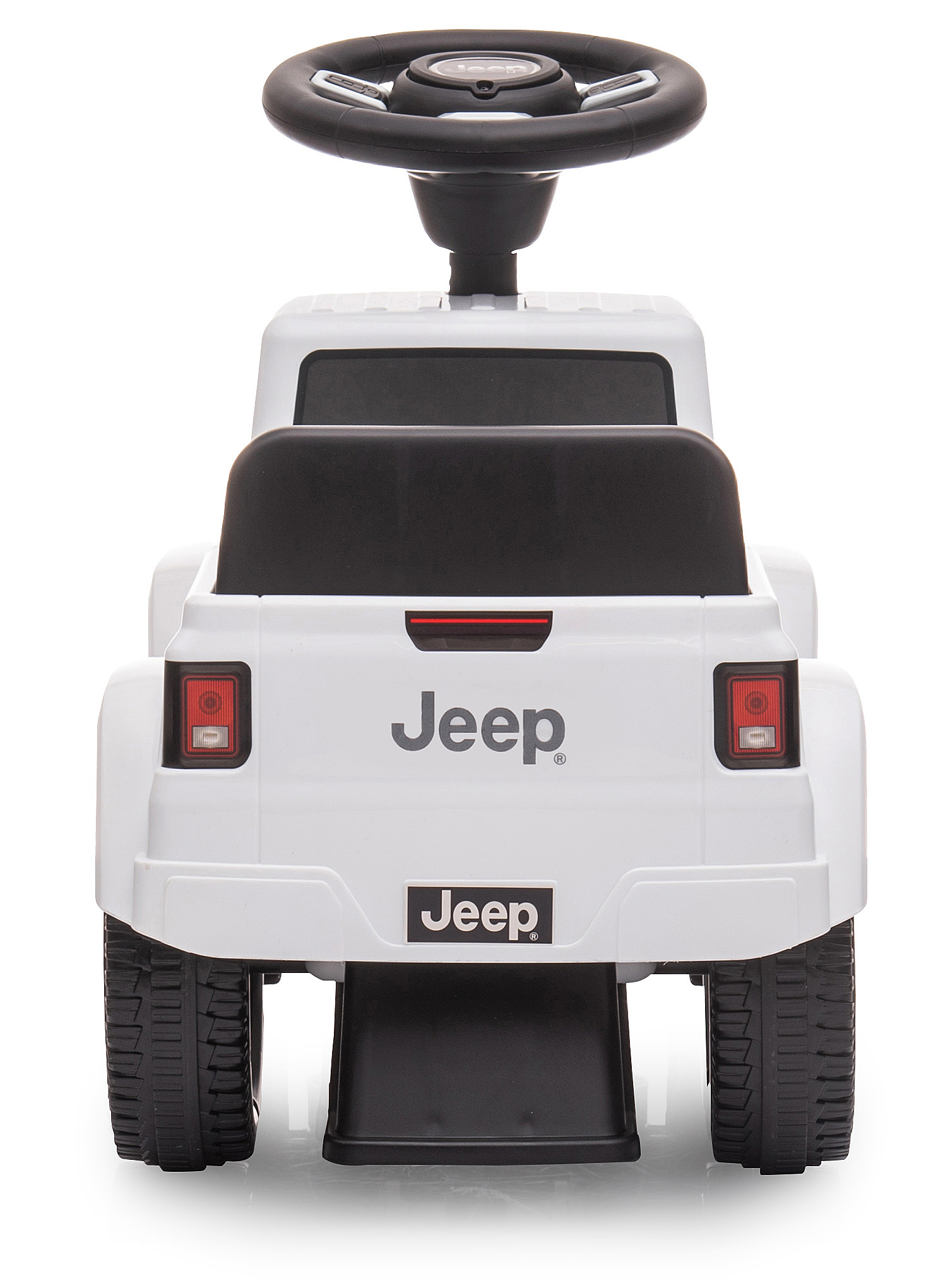 Ein weißes Jeep-Spielzeugauto. Es hat schwarze Räder, ein Lenkrad und das Jeep-Logo auf der Rückseite.