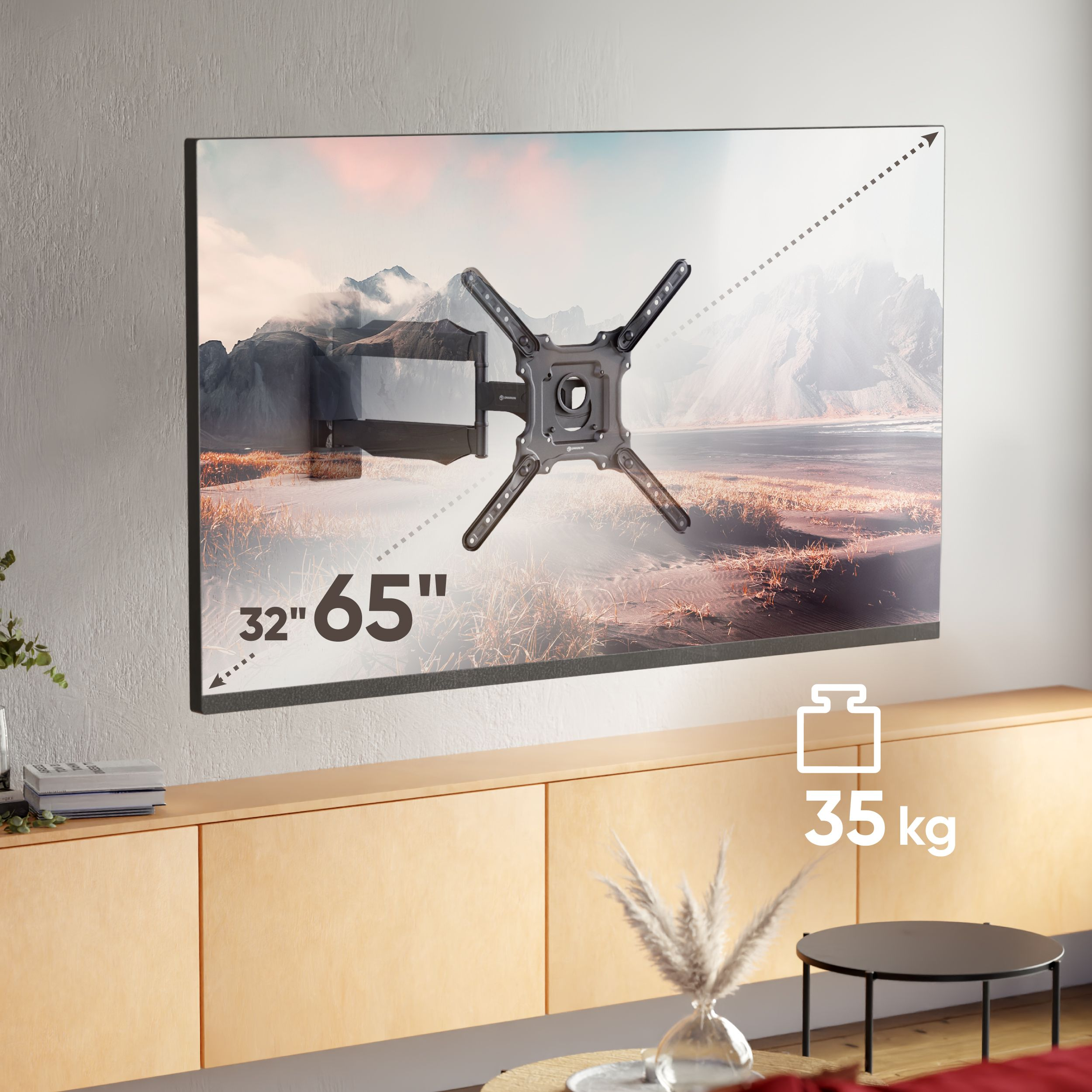 Uchwyt TV wyświetla krajobraz. Tekst wskazuje rozmiar 32"-65" i udźwig 35 kg. Uchwyt jest na drewnianej szafce.