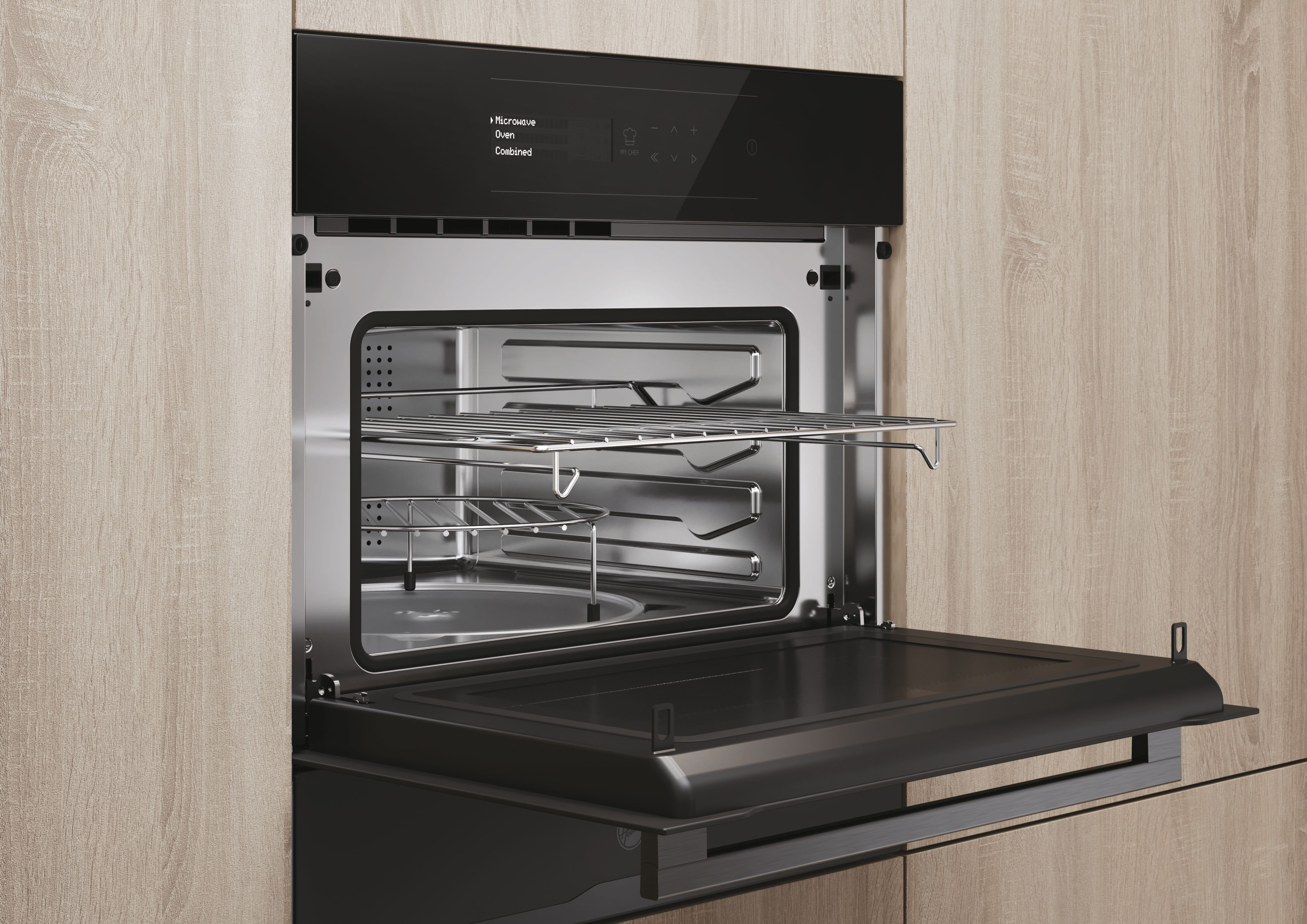 Un forno a microonde a incasso aperto. La porta è aperta. L'interno ha ripiani. Il pannello mostra le opzioni.