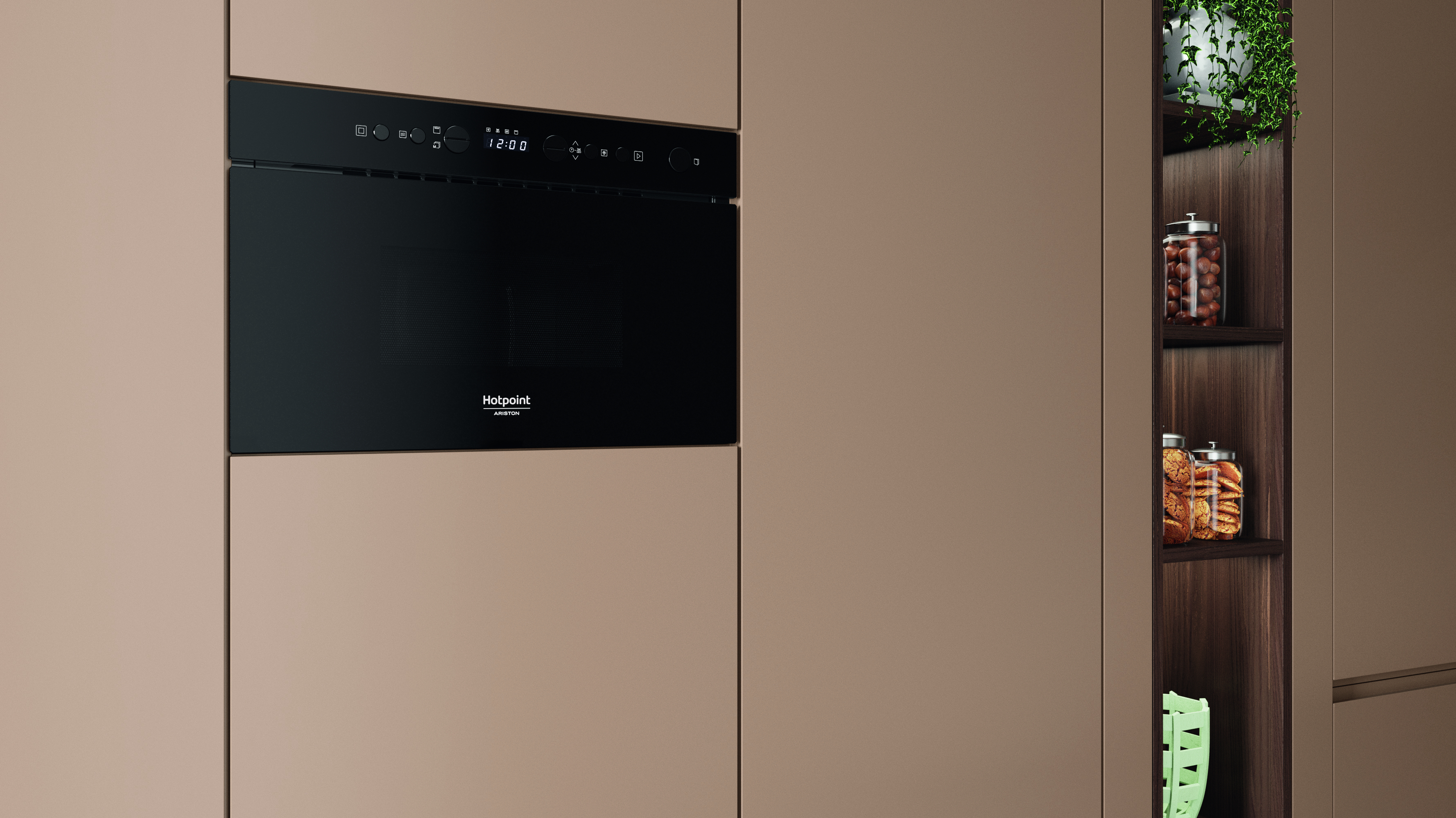 Un horno negro empotrado con pantalla digital y nombre de marca. Un armario con frascos de comida y vegetación.