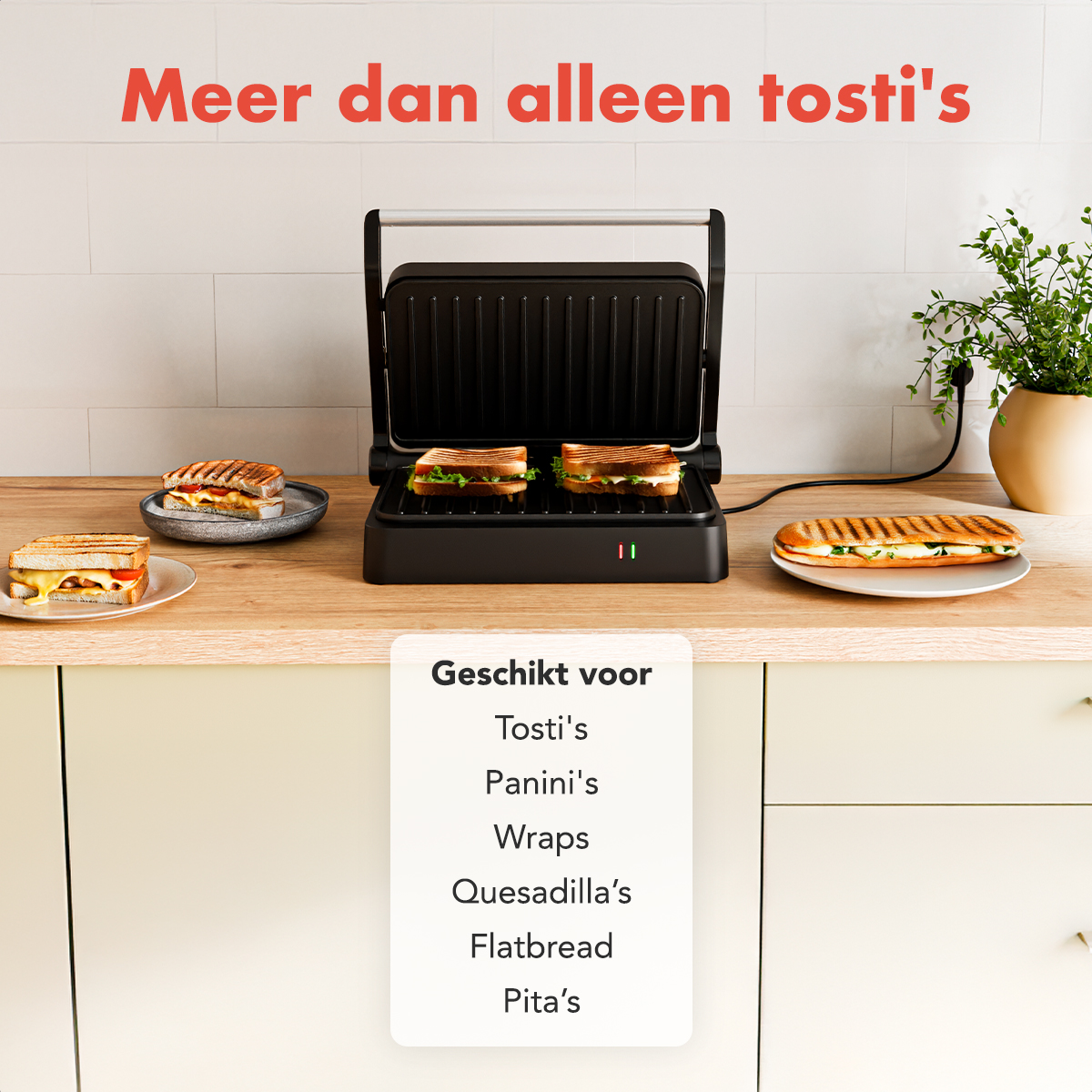 A black sandwich maker with sandwiches on a wooden surface. A sign indicates it's suitable for tosti's, panini's, wraps, and more.