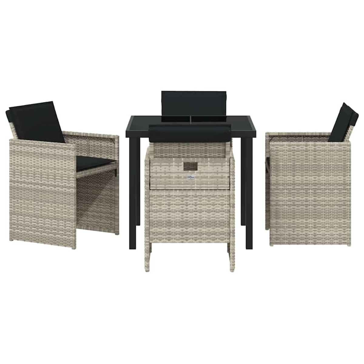 Set da esterno in vimini con tavolo e sedie. Il tavolo ha un piano in vetro nero. Le sedie hanno cuscini neri. Colori neutri.