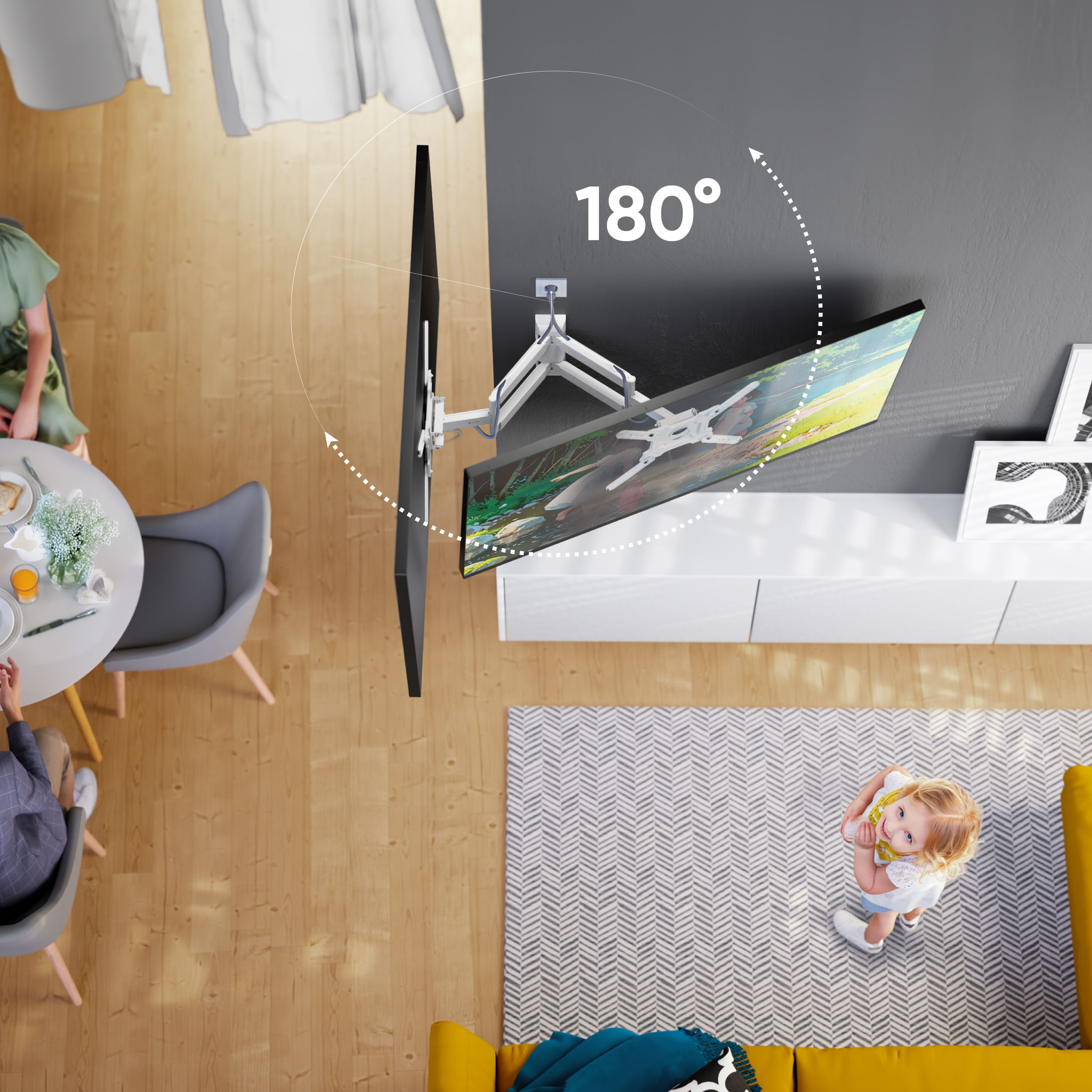 Widok z góry pokazuje telewizor na uchwycie, stół jadalny i dziecko na wzorzystym dywanie. Telewizor obraca się o 180 stopni.