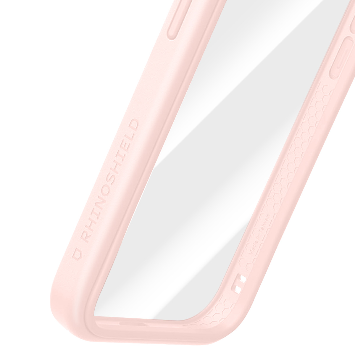 Primo piano di una custodia rosa per telefono con il marchio 'RhinoShield'. La custodia ha un centro trasparente e un motivo a nido d'ape.
