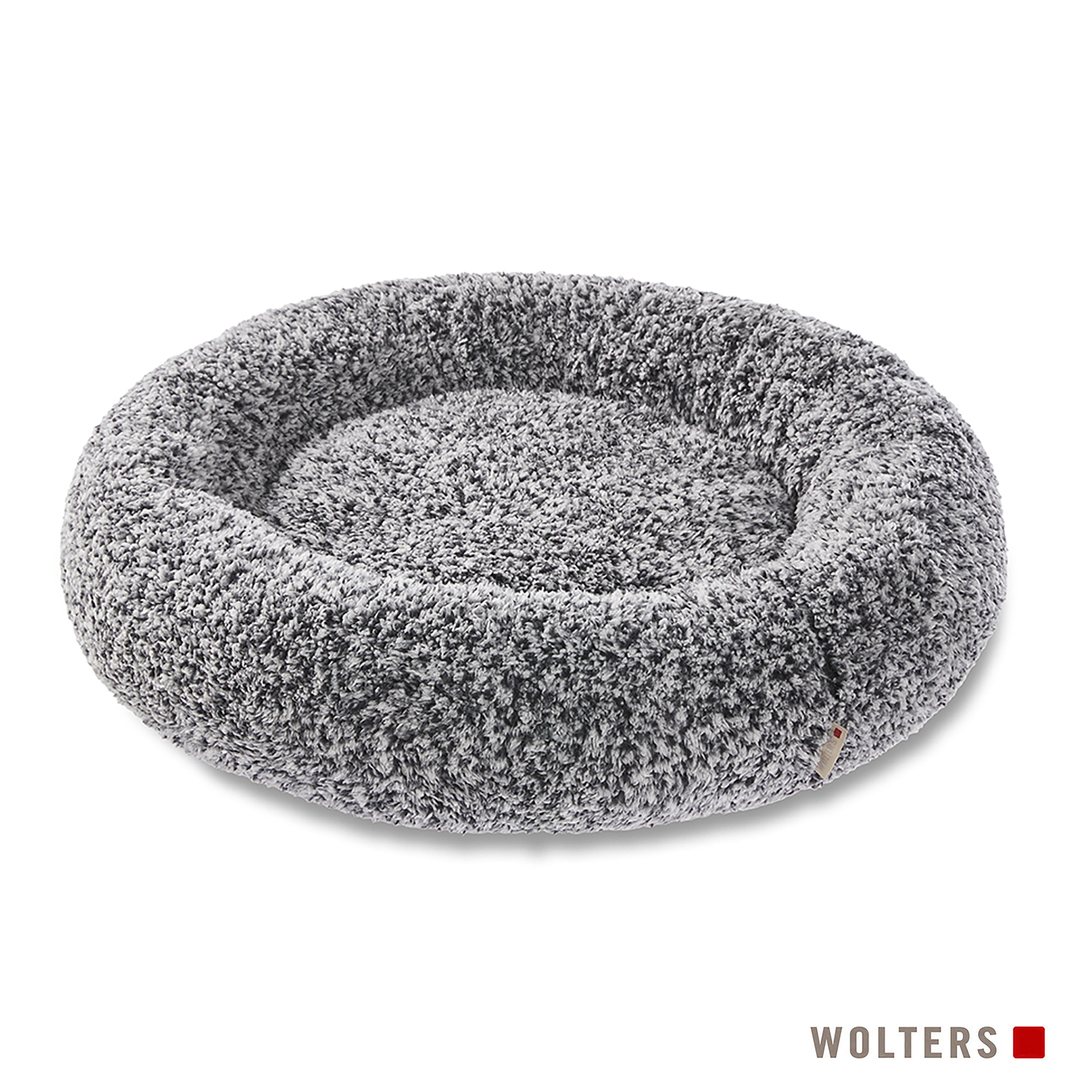 Ein rundes Hundebett mit grauem und weißem flauschigem Material. Der Markenname 'WOLTERS' steht unten.