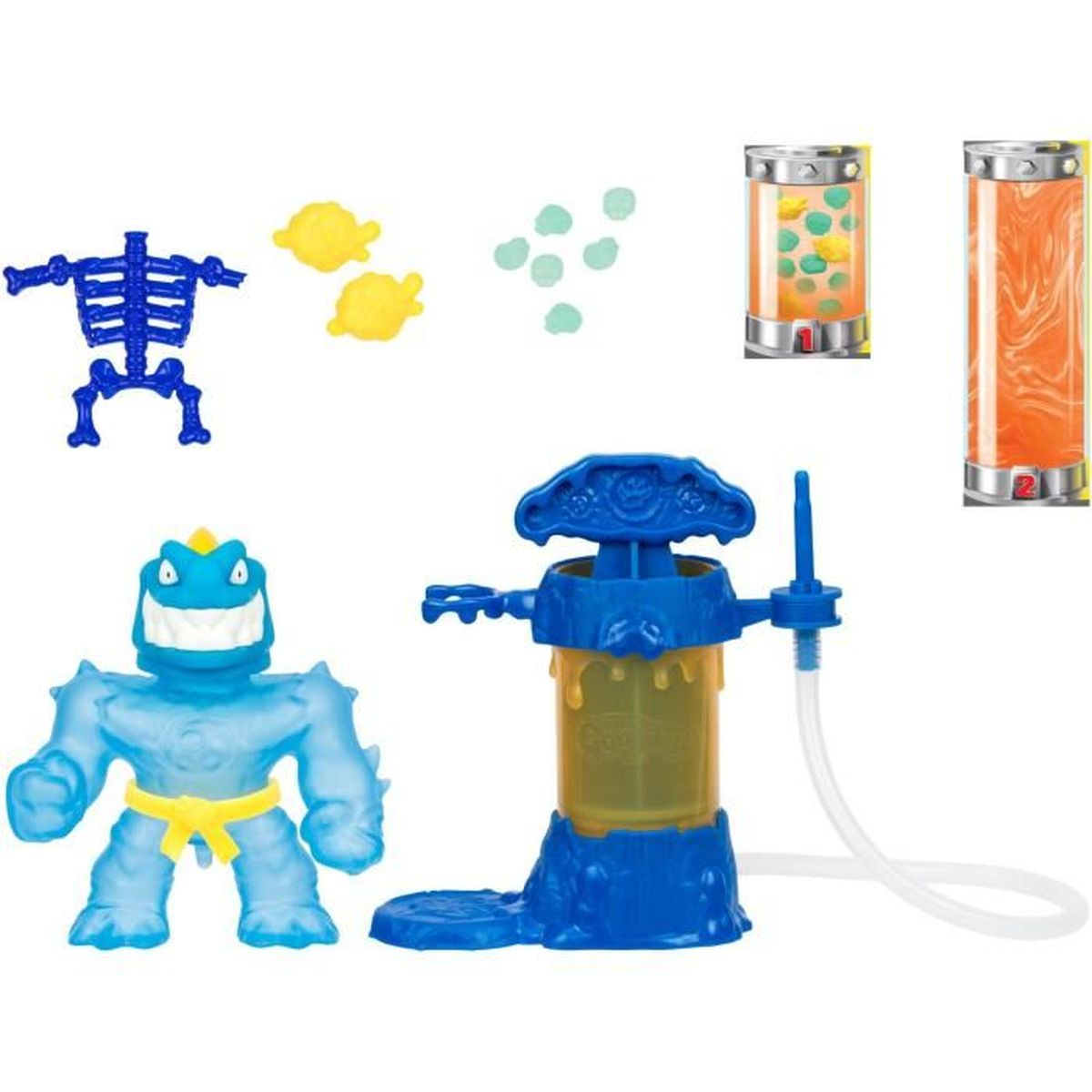 Ein blaues Monstertierspielzeug, ein Skelett und andere Spielzeugteile werden angezeigt. Auch eine blaue Maschine mit einem gelben Behälter ist vorhanden.