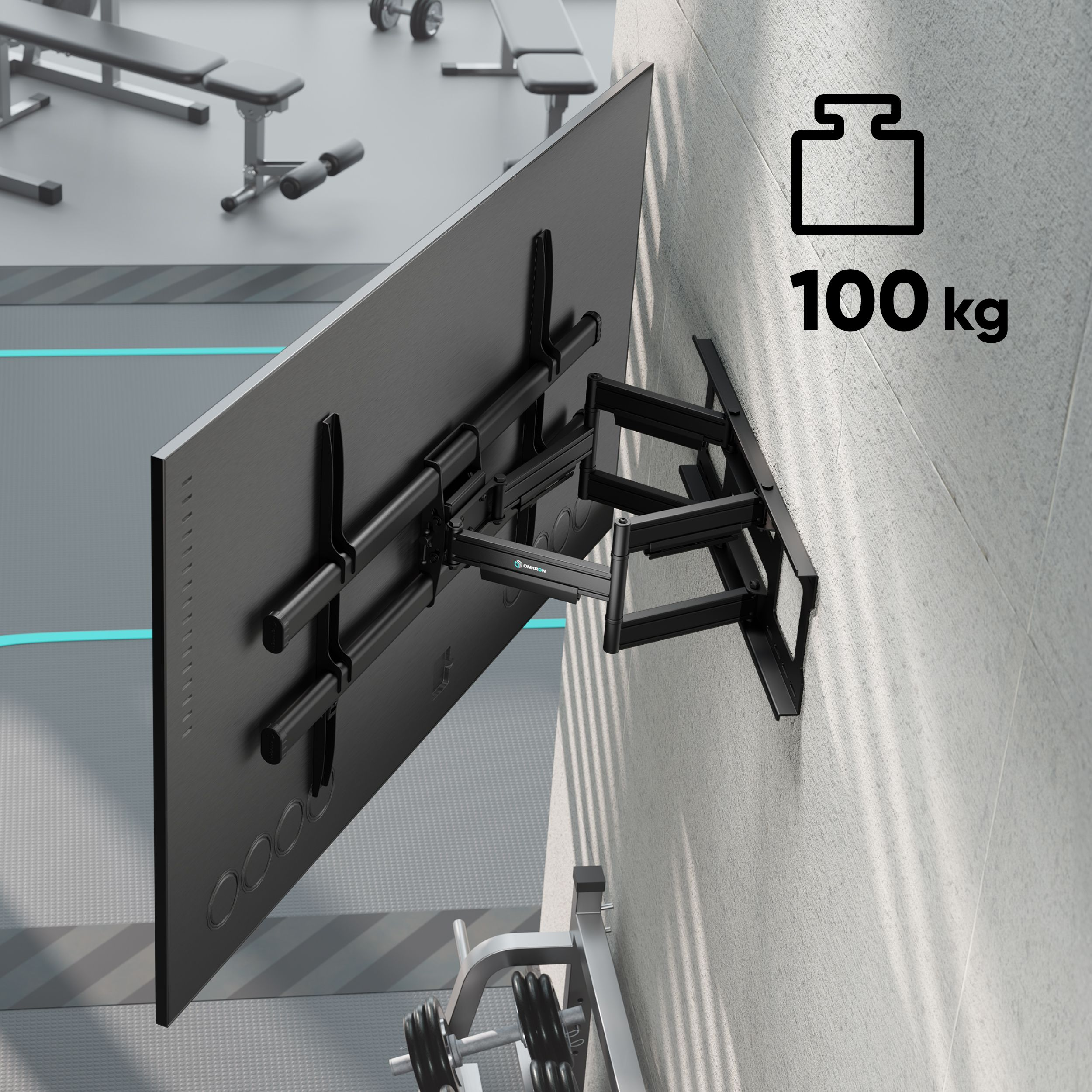 Czarny telewizor jest zamontowany na ścianie z czarnym uchwytem. W tle ciężary i sprzęt do ćwiczeń.