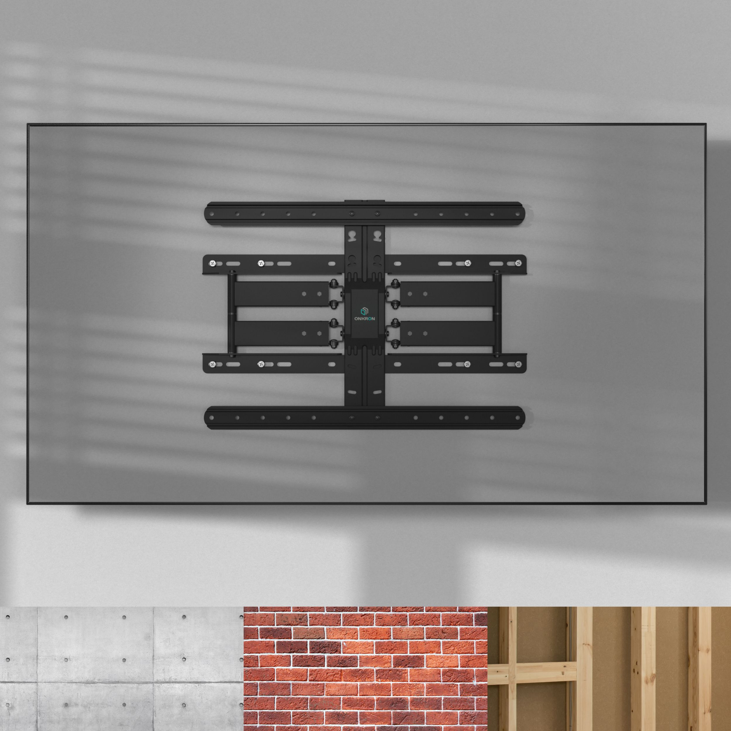 Czarny uchwyt do telewizora jest przymocowany do szarej ściany. Uchwyt jest wyśrodkowany i ma wiele prętów i otworów.