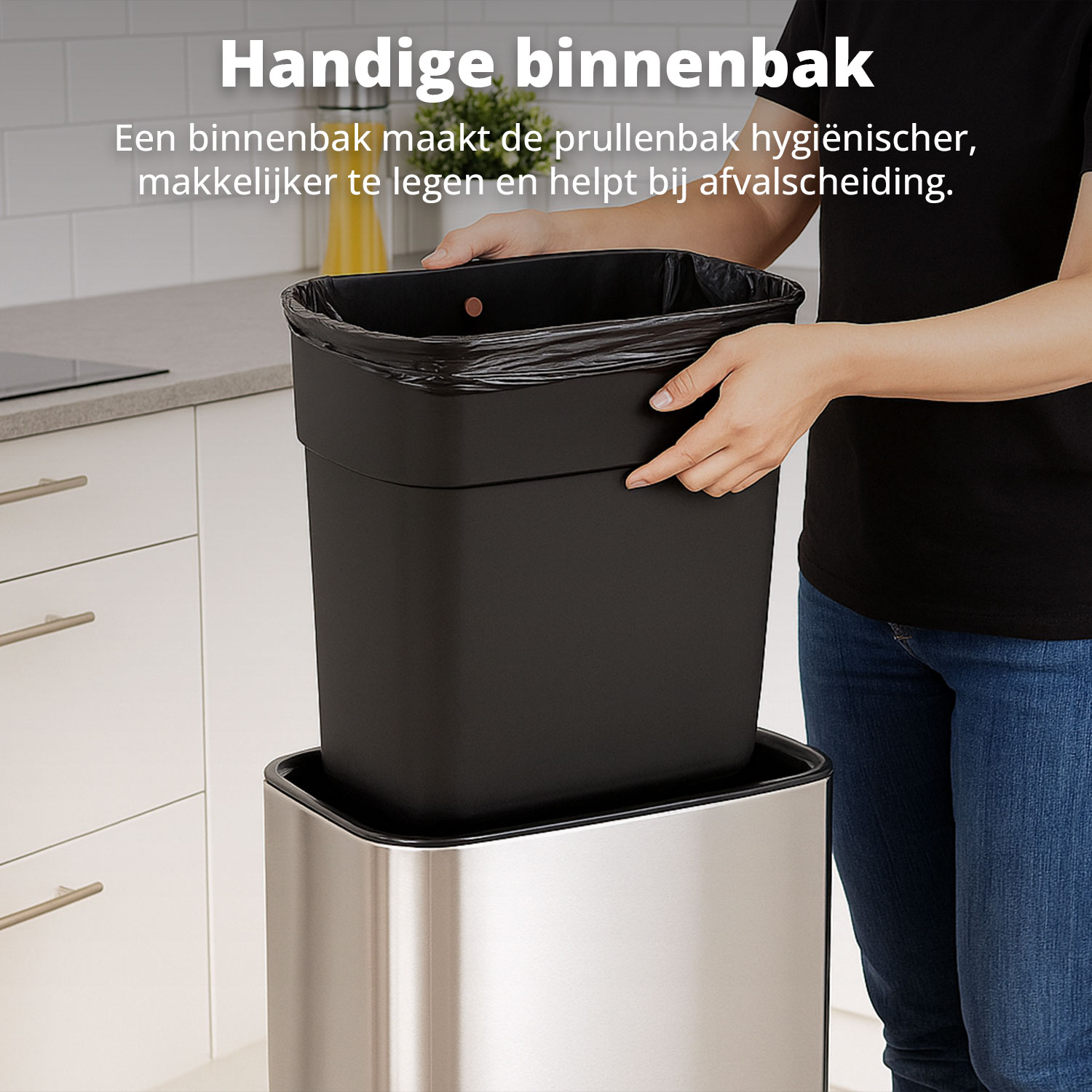 A person holds a black bin liner inside a silver bin. The liner is in a black plastic bin. Text says 'Handige binnenbak'.