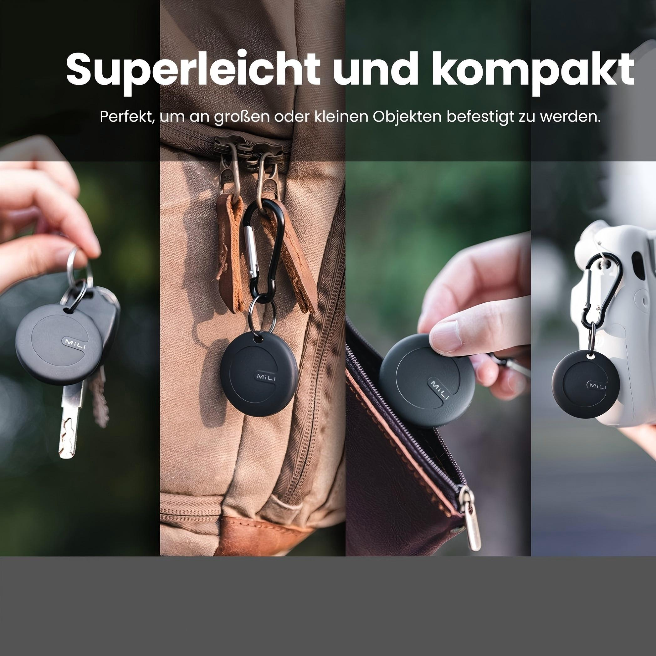 Das Bild zeigt schwarze, kreisförmige Anhänger, die an Schlüsseln, einem Rucksack, einer Geldbörse und einer weißen Kamera befestigt sind.