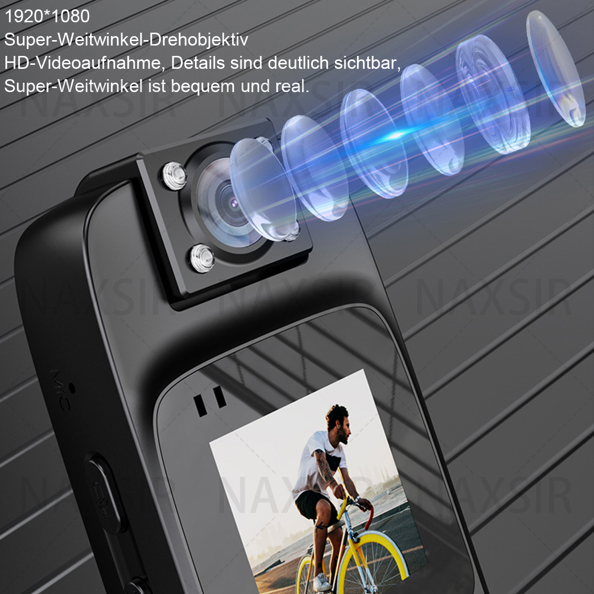 Eine schwarze Action-Kamera mit Objektiv-Display zeigt einen Mann auf einem gelben Fahrrad. Der Hintergrund ist eine dunkelgraue Oberfläche.