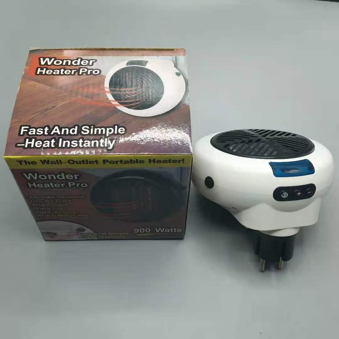 Ein weißer Wonder Heater Pro und seine Schachtel stehen auf einer grauen Oberfläche. Der Heizkörper ist eingesteckt und hat ein schwarzes Gitter.