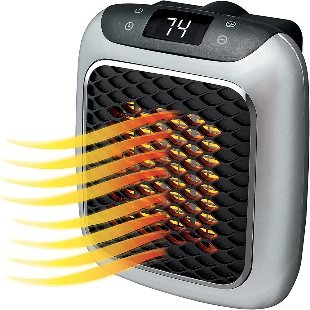 Ein silber-schwarzer Heizlüfter mit digitaler Anzeige 74. Orange und gelbe Hitzewellen gehen von der Vorderseite aus.