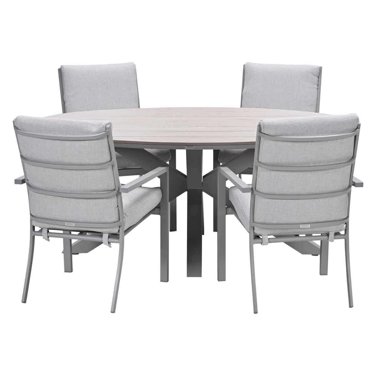 A round outdoor dining set. It has a light gray wooden table and four chairs with light gray cushions and gray metal frames.
