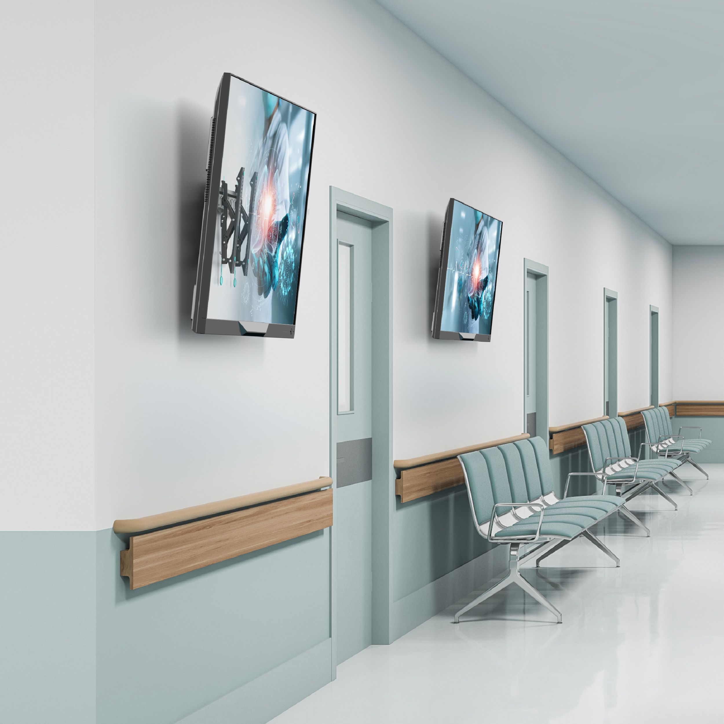 Korytarz szpitalny z ekranami, drzwiami i miejscami do siedzenia. Ekrany wyświetlają wizualizacje medyczne.